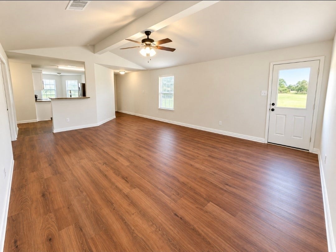 12221 Seacrest Lane, Texas City, TX 77568 The spacious living room has brand-new luxury vinyl flooring and high ceilings.