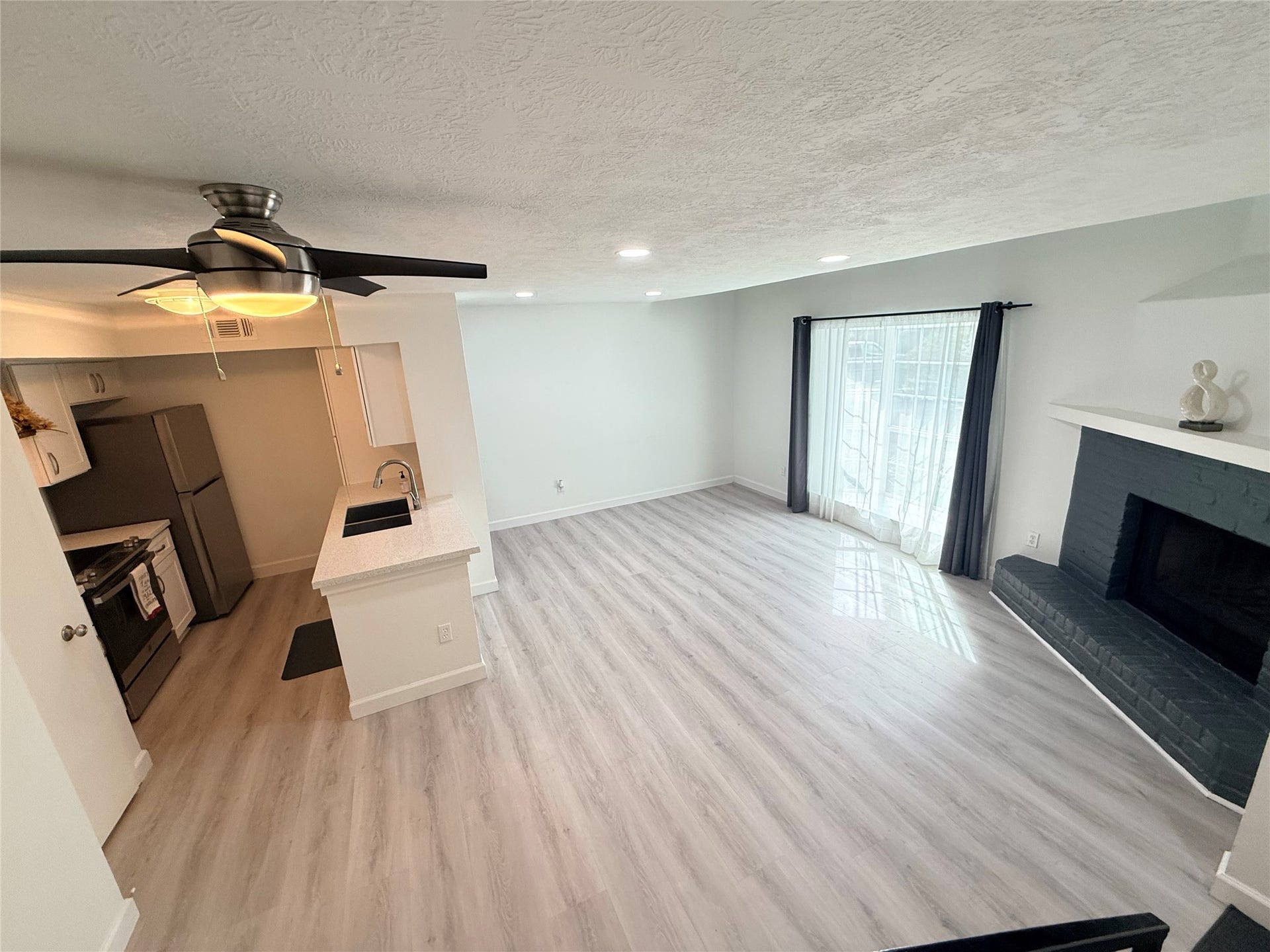 2800 Jeanetta Street, #2402, Houston, TX 77063 View from stairs looking at the large open living room and kitchen!