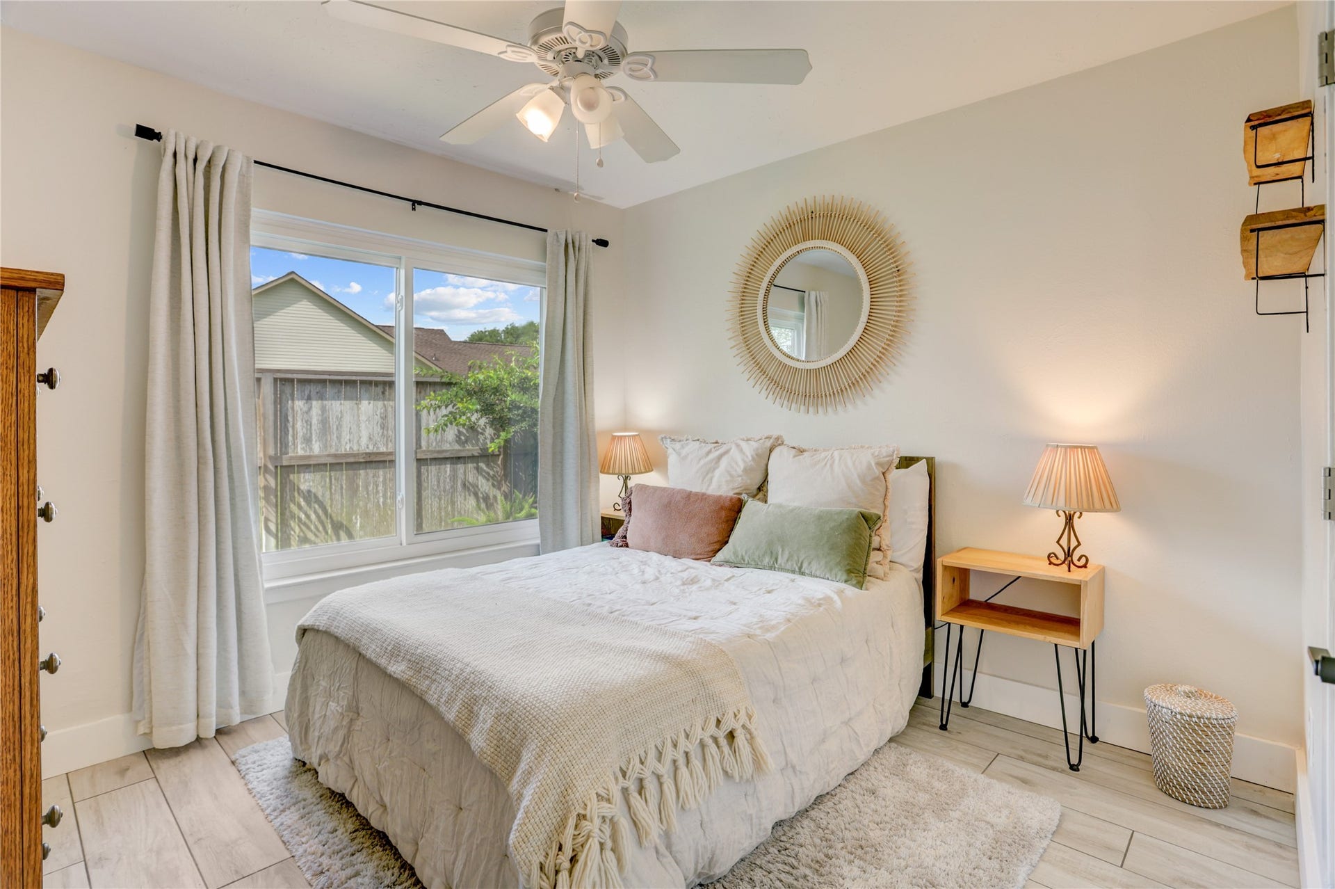 3311 Carmel Valley Drive, Missouri City, TX 77459 Bright and inviting secondary bedroom features large window, neutral designer finishes, updated flooring and a calming color palette. A comfortable retreat for guests, family or a home office.