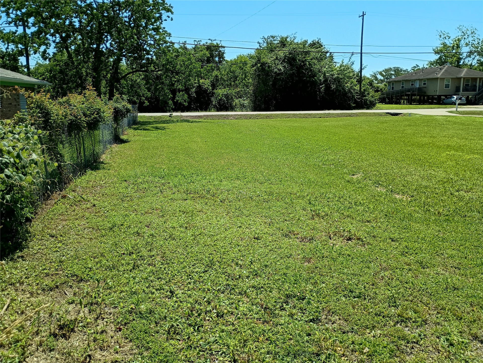 0 Fairwood Road, Hitchcock, TX 77563 The left side back corner of the lot facing Fairwood Road.