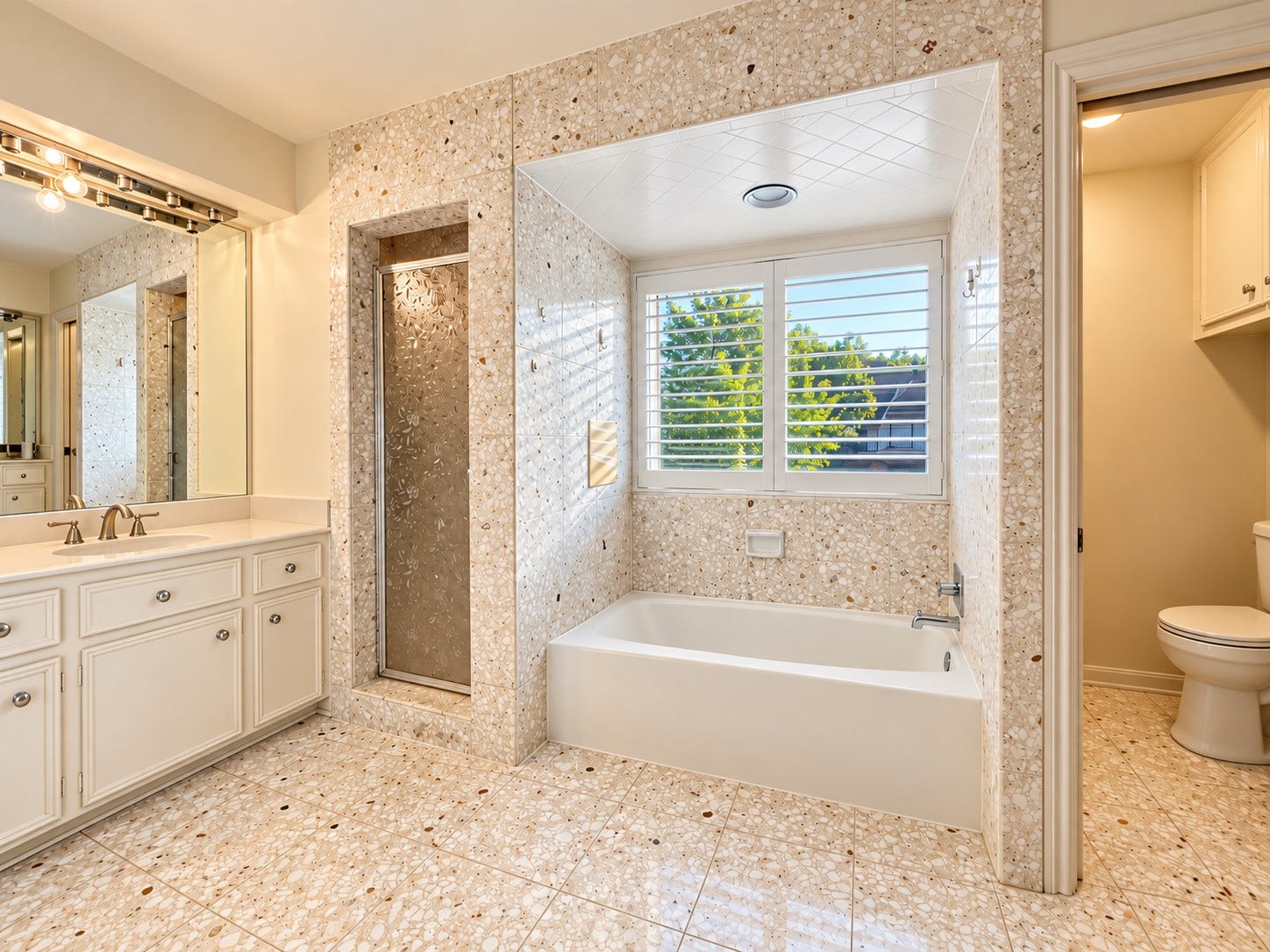 201 Vanderpool Lane, #86, Houston, TX 77024 main bathroom with double sink and separate shower room