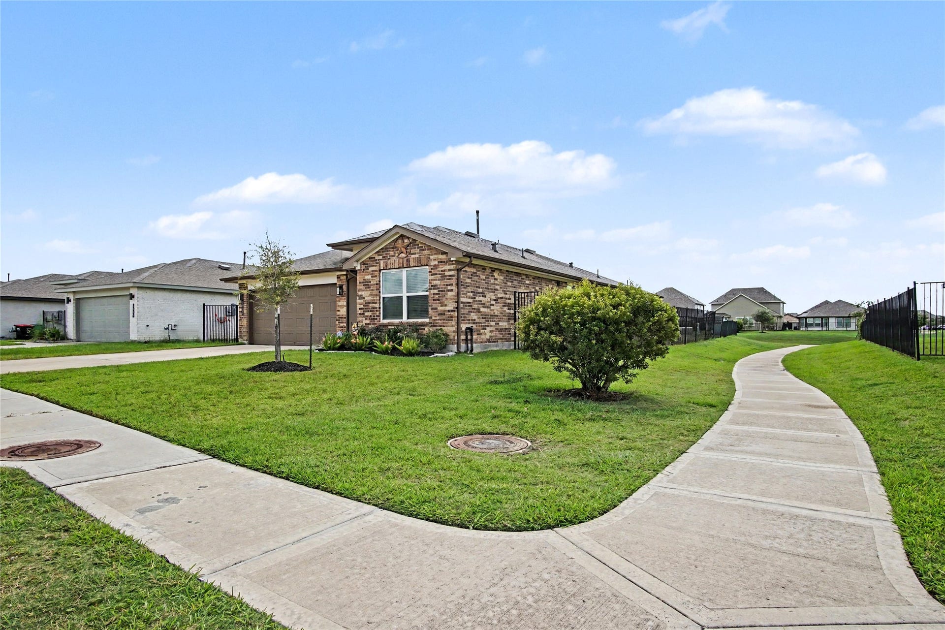 This upgraded lot features an extra wide space between homes, along with a water view in the back!