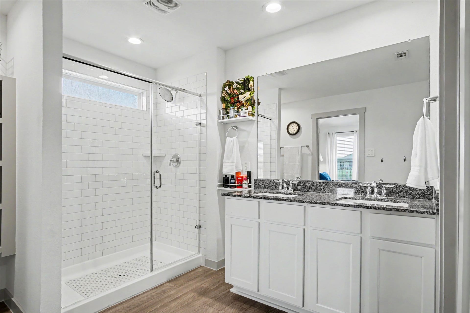 Dual sinks, granite countertops, extra storage space make this primary bathroom IDEAL!