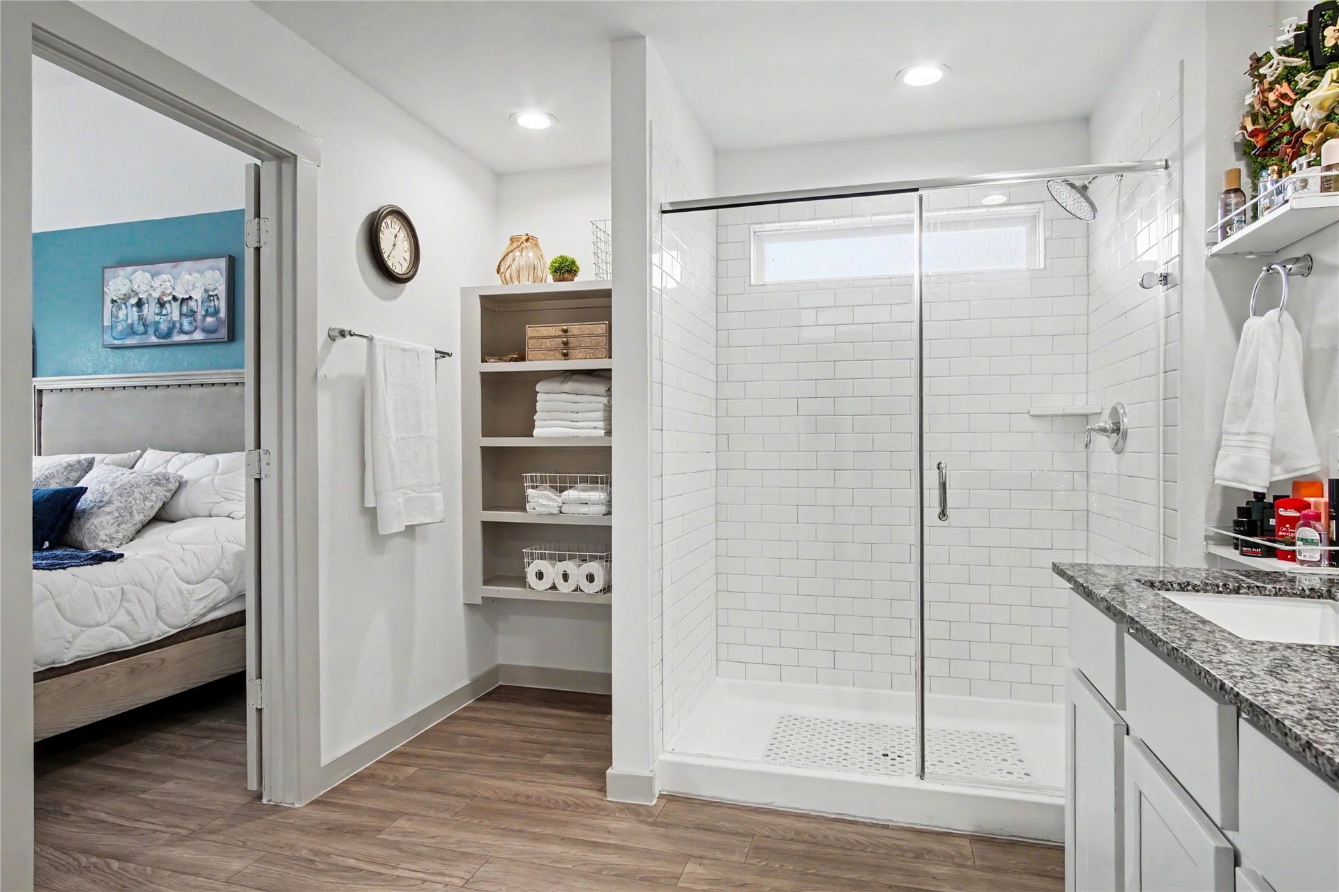 Beautiful shelving behind the shower create the spa feel that owners will love!