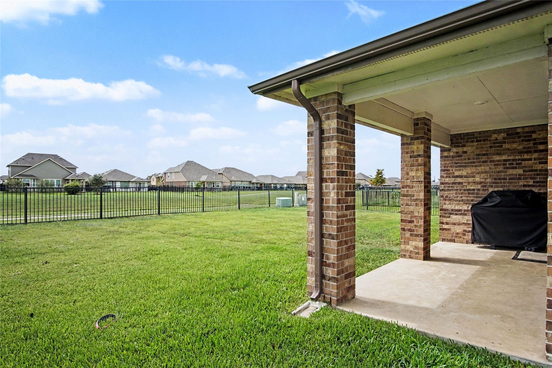 Beautiful outdoor space for entertaining!  Covered patio with water views make this home special!