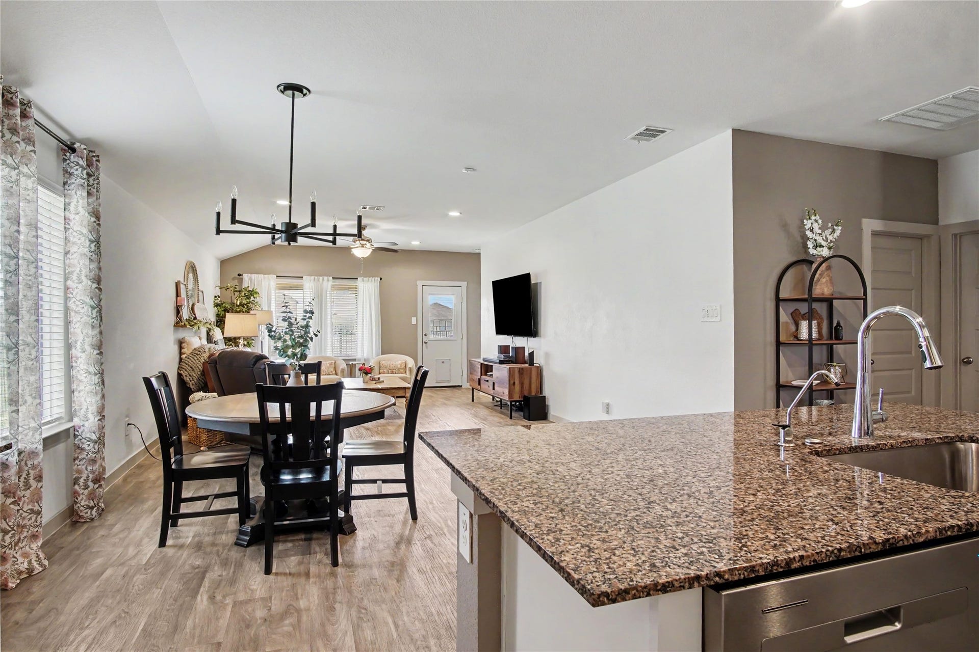 The owners have added several lighting fixtures and fans to create the perfect atmosphere in this like-new home.