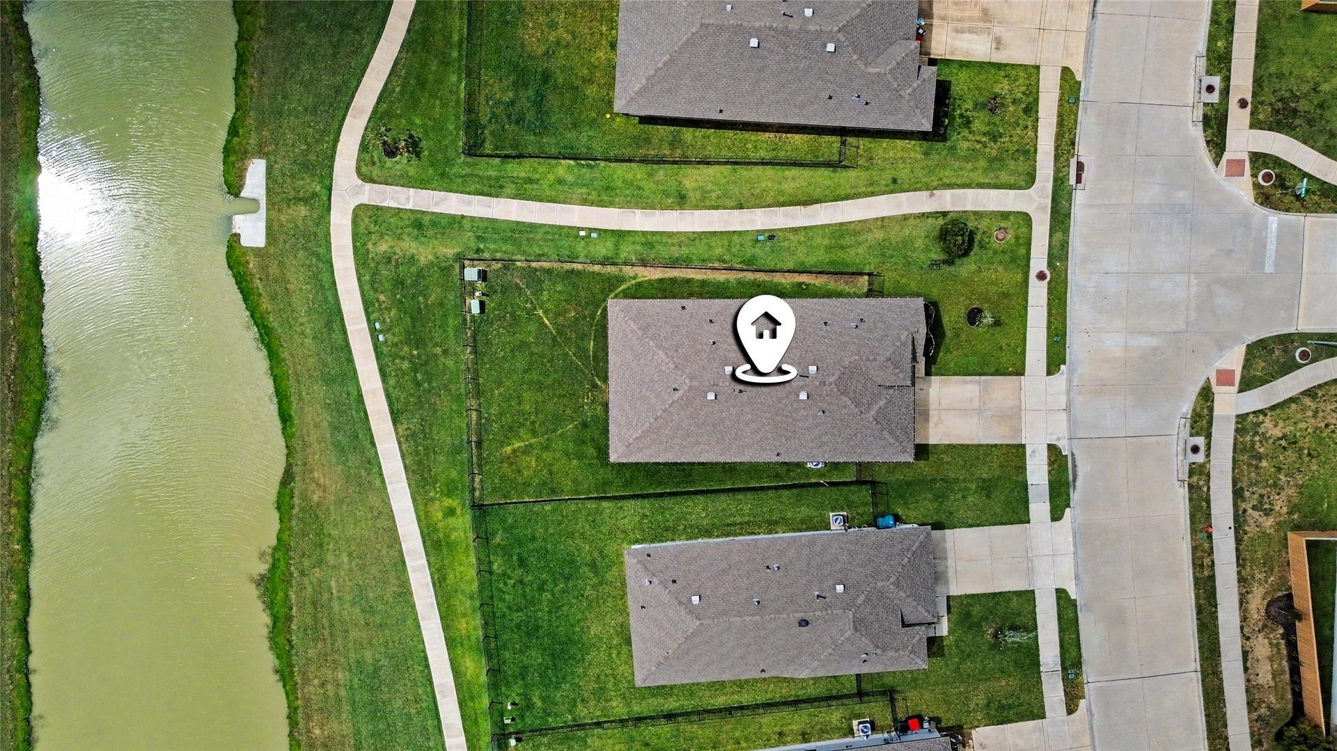 View from overhead, highlighting this rare lot with extra space and water views!