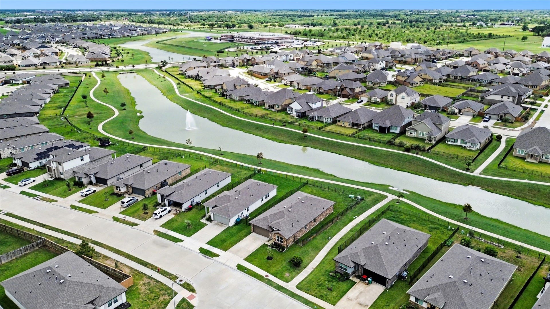At the bottom/center of the photo you see the home.  At the top/center of the photo, you see the location of the elementary school.  It's within walking distance, but far enough away so you don't experience traffic issues at pick up and drop off times.