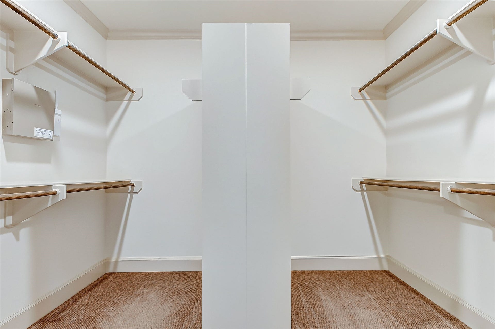 1955 Sheridan Street, Houston, TX 77030 Discover the luxury of a primary bedroom boasting an expansive walk-in closet equipped with double-sided clothes rods, perfect for organizing your wardrobe with ease.