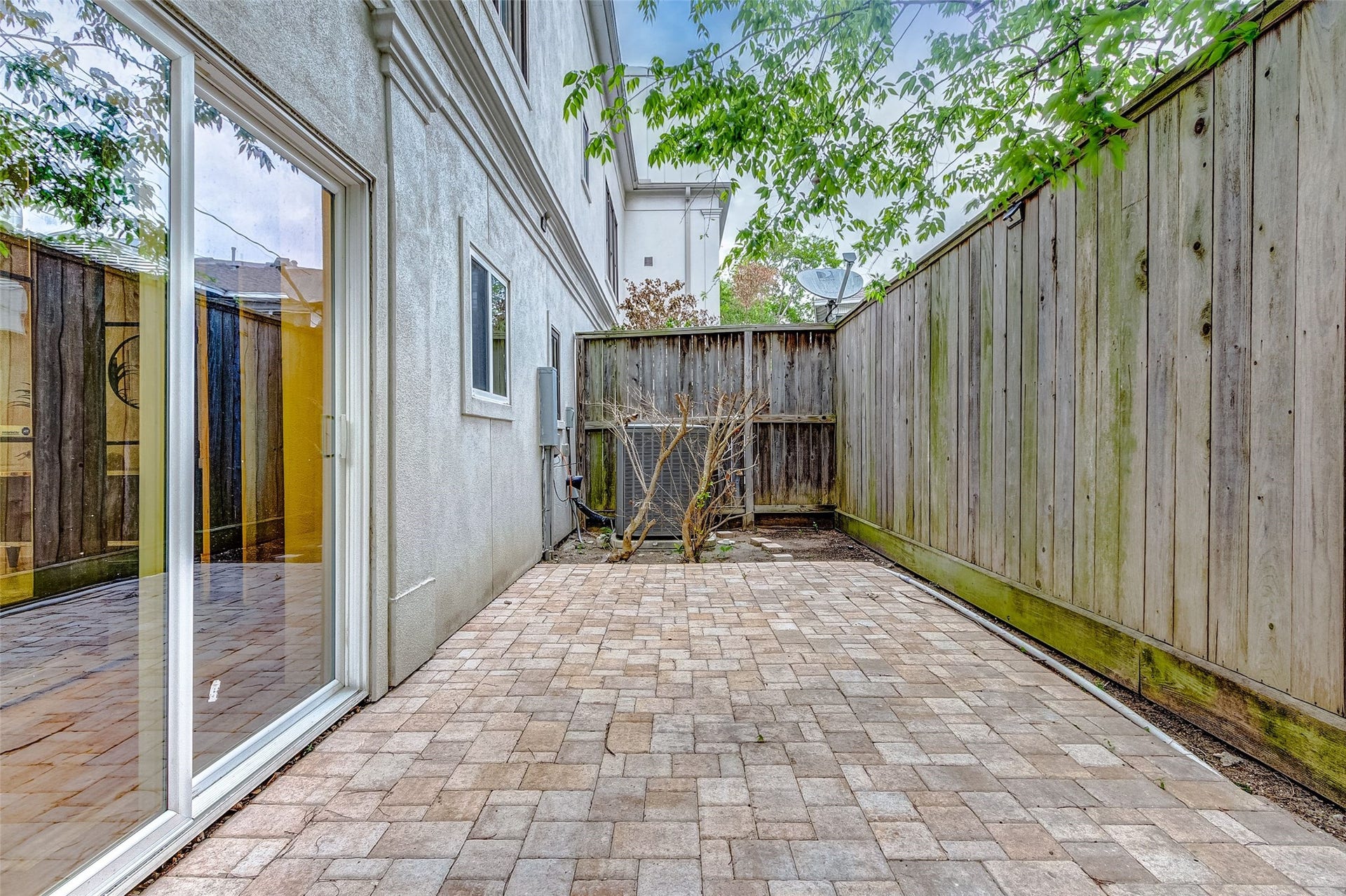 1955 Sheridan Street, Houston, TX 77030 Experience seamless indoor-outdoor living with two charming patio spaces perfect for relaxation and entertaining.