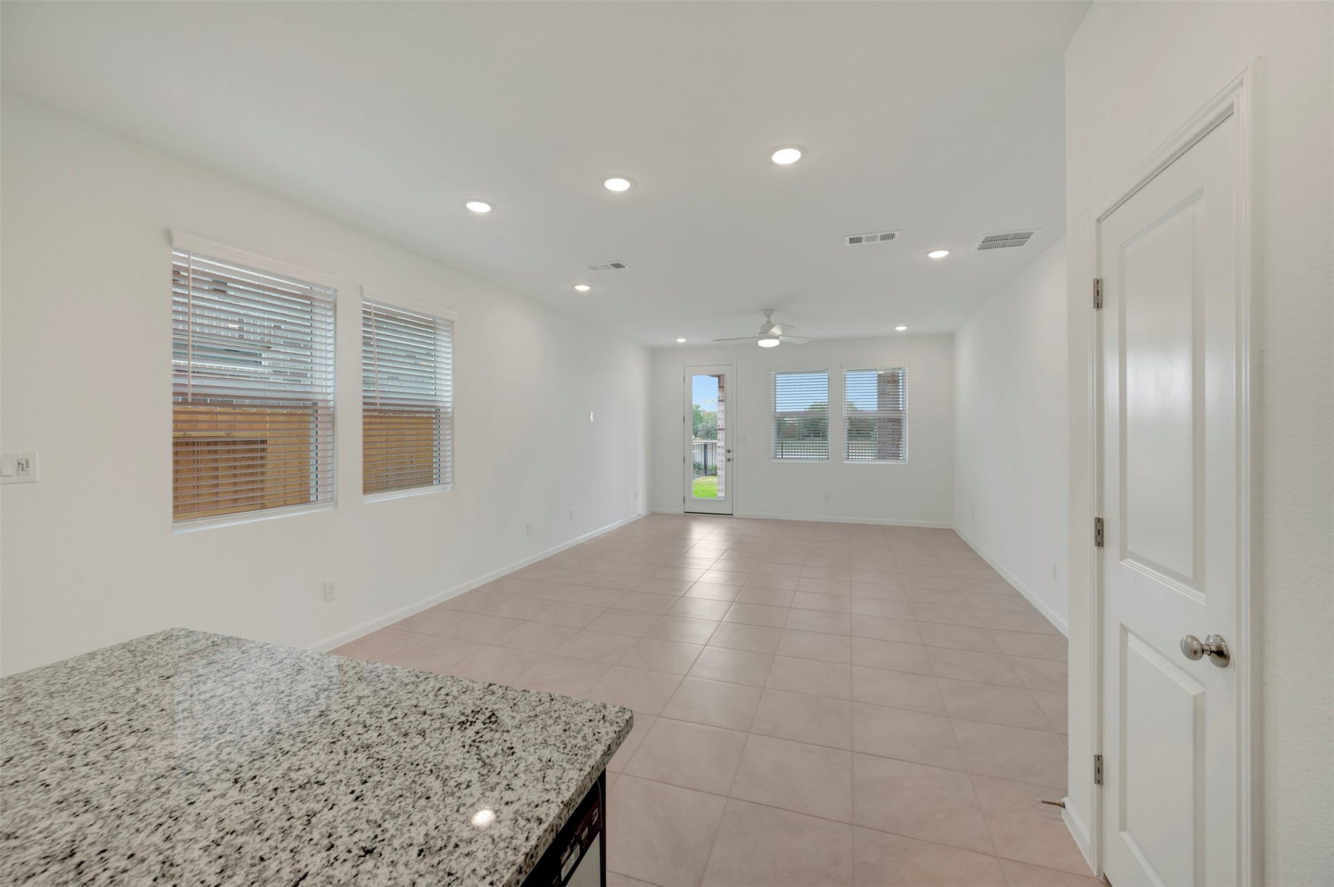 Kitchen overlooks dining area and great room