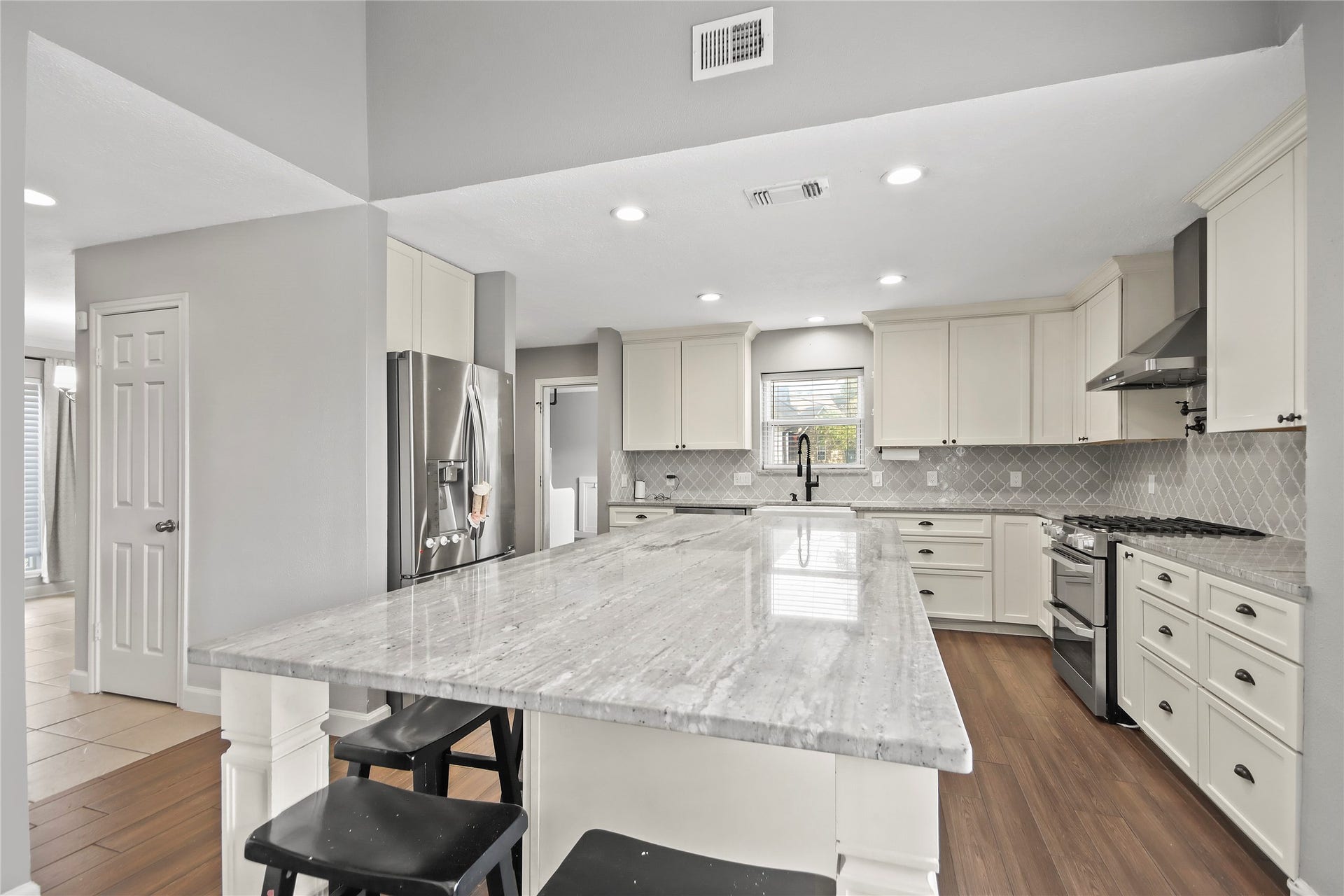 3527 Eula Morgan Road, Katy, TX 77493 The kitchen is a showstopper, featuring a oversized granite island with bar seating and stainless steel appliances.