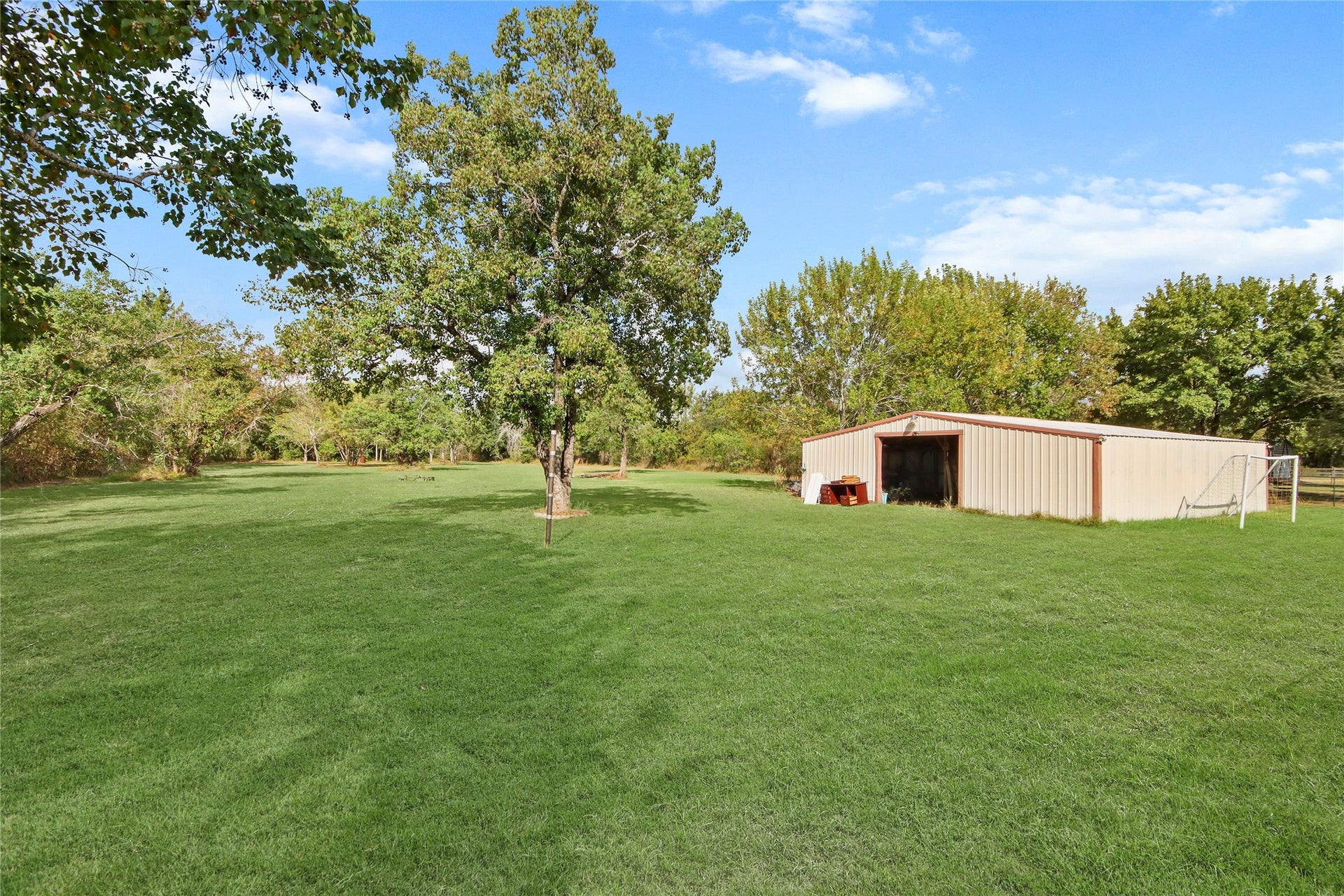 3527 Eula Morgan Road, Katy, TX 77493 Tucked at the edge of the expansive lot, a large storage shed offers abundant space for equipment, tools, lawn gear, or a future workshop.