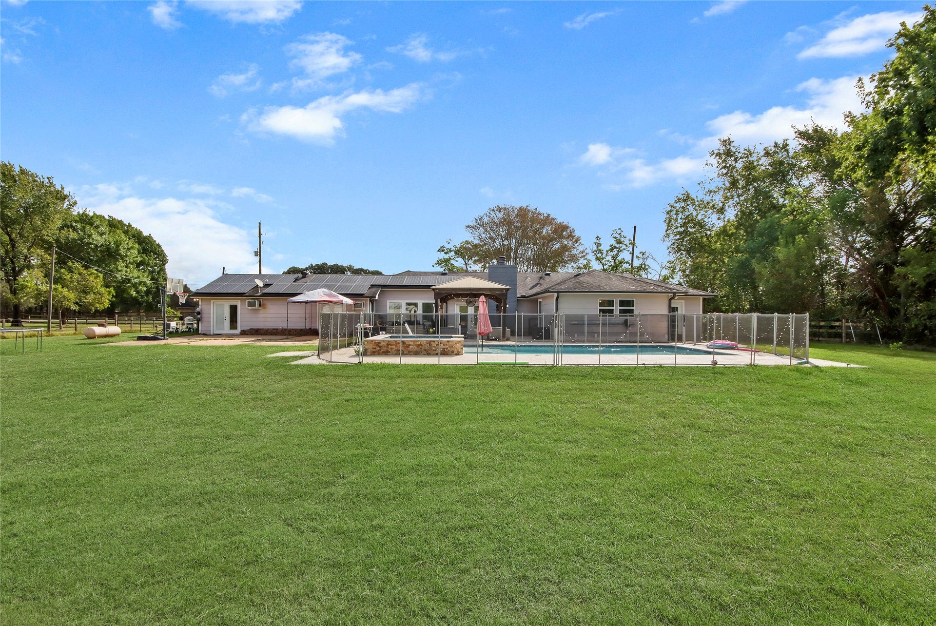 3527 Eula Morgan Road, Katy, TX 77493 The spacious backyard offers room to relax, play, and entertain, all set on this expansive lot.