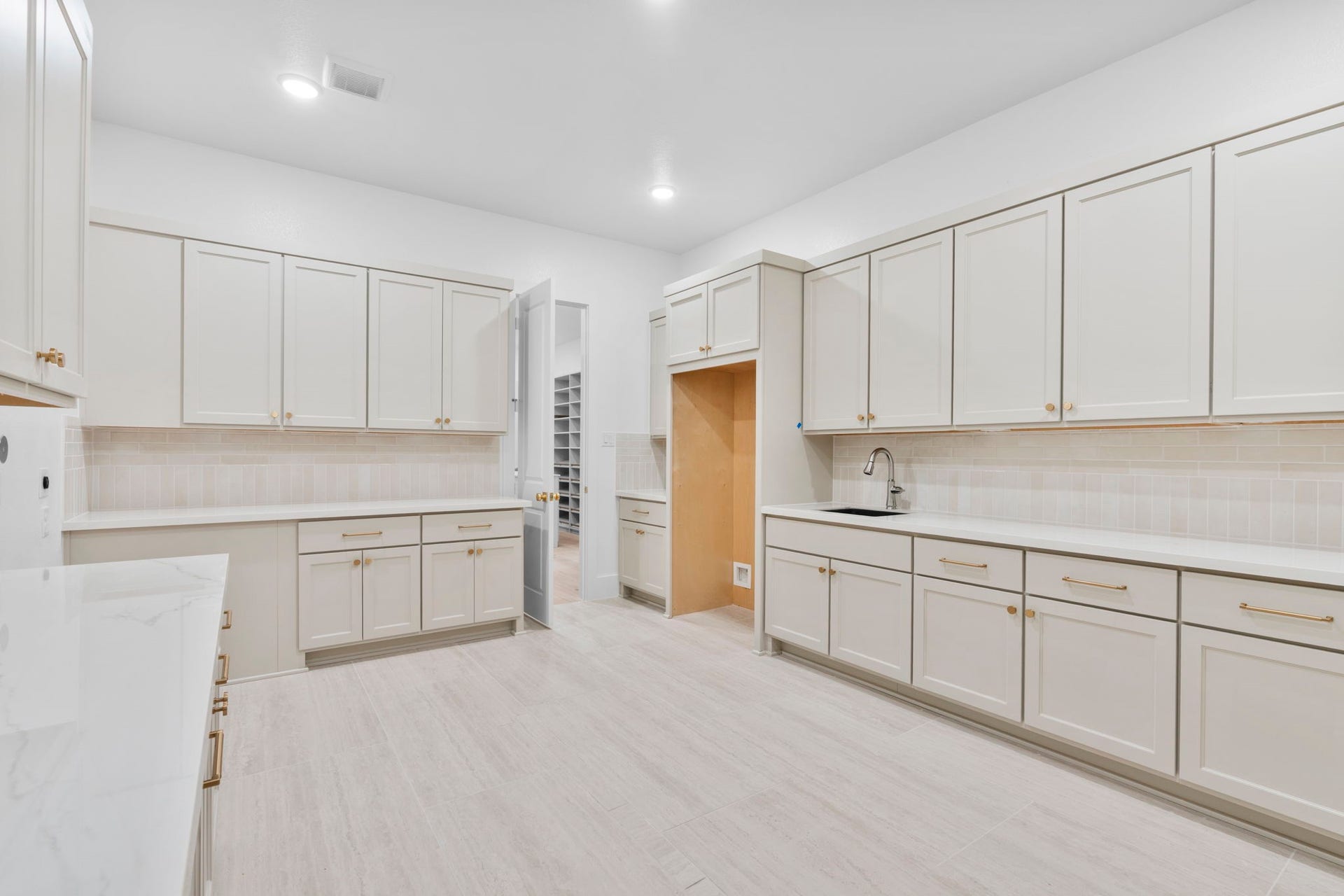 11110 Openwood Lands Lane, Cypress, TX 77433 Who doesn't want a separate prep kitchen/laundry room with refrigerator, second sink and tons of space for storage!!