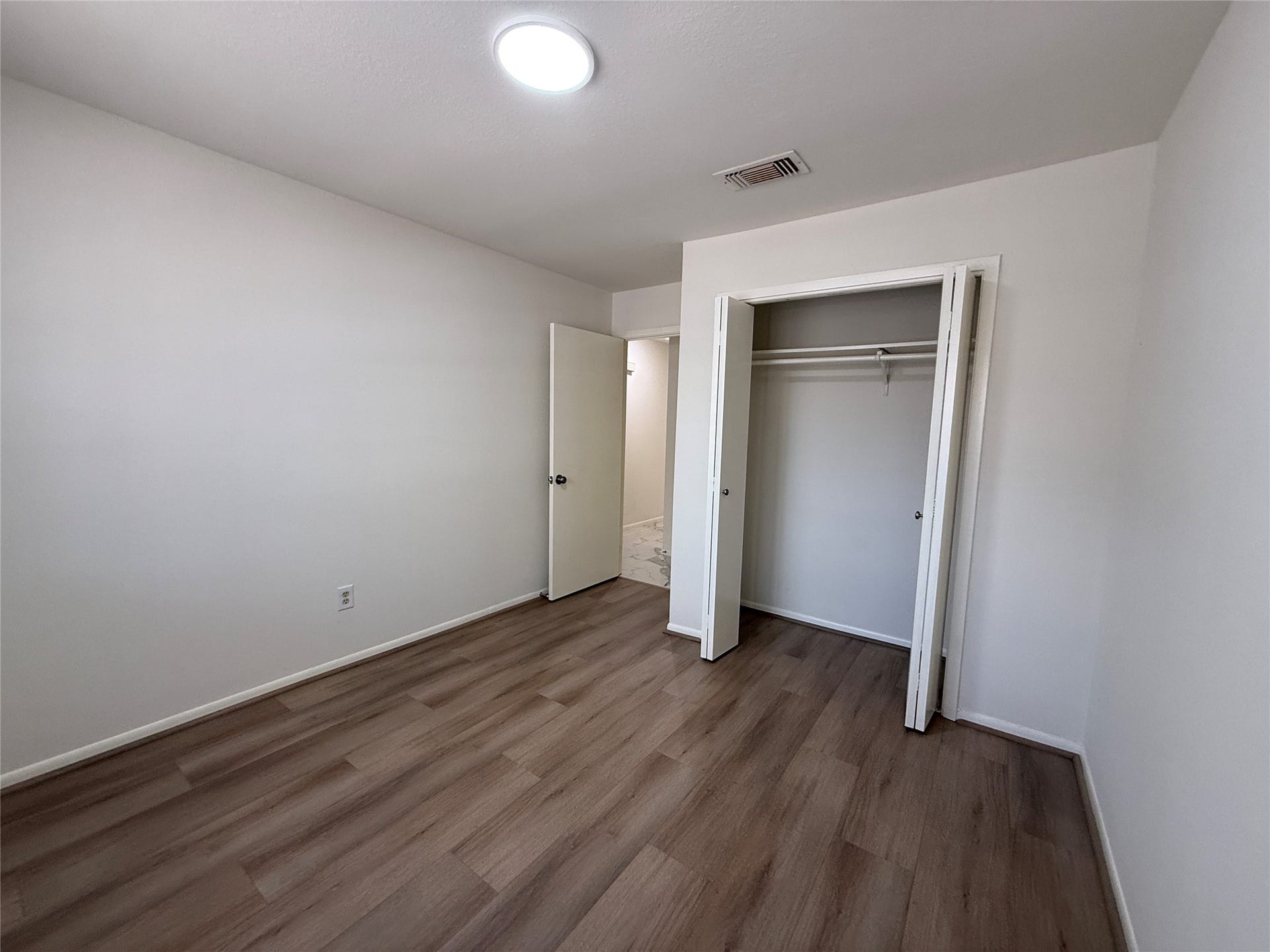 Vinyl floor in the second bedroom.
