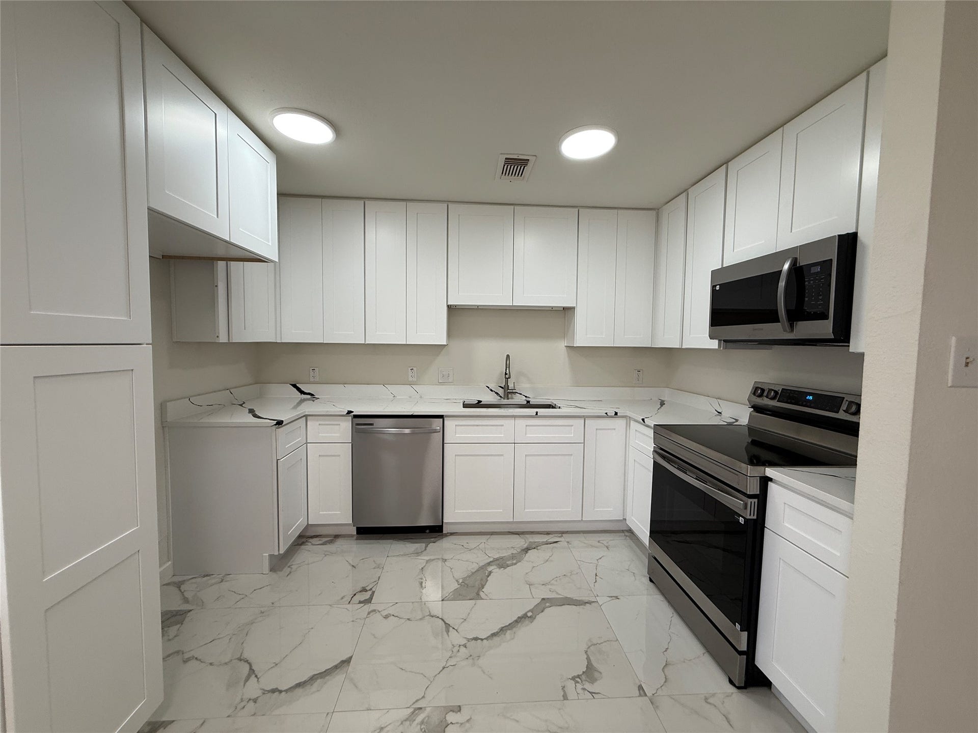 Kitchen with new cabinets and appliances.