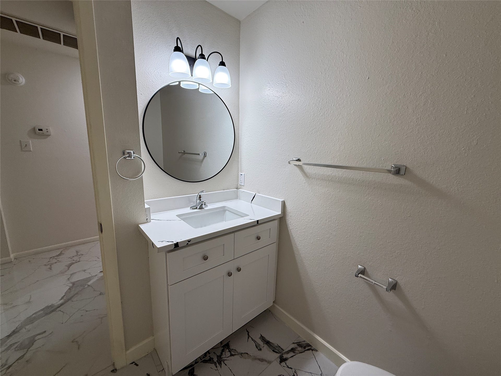 Second bathroom with new vanity and floor.