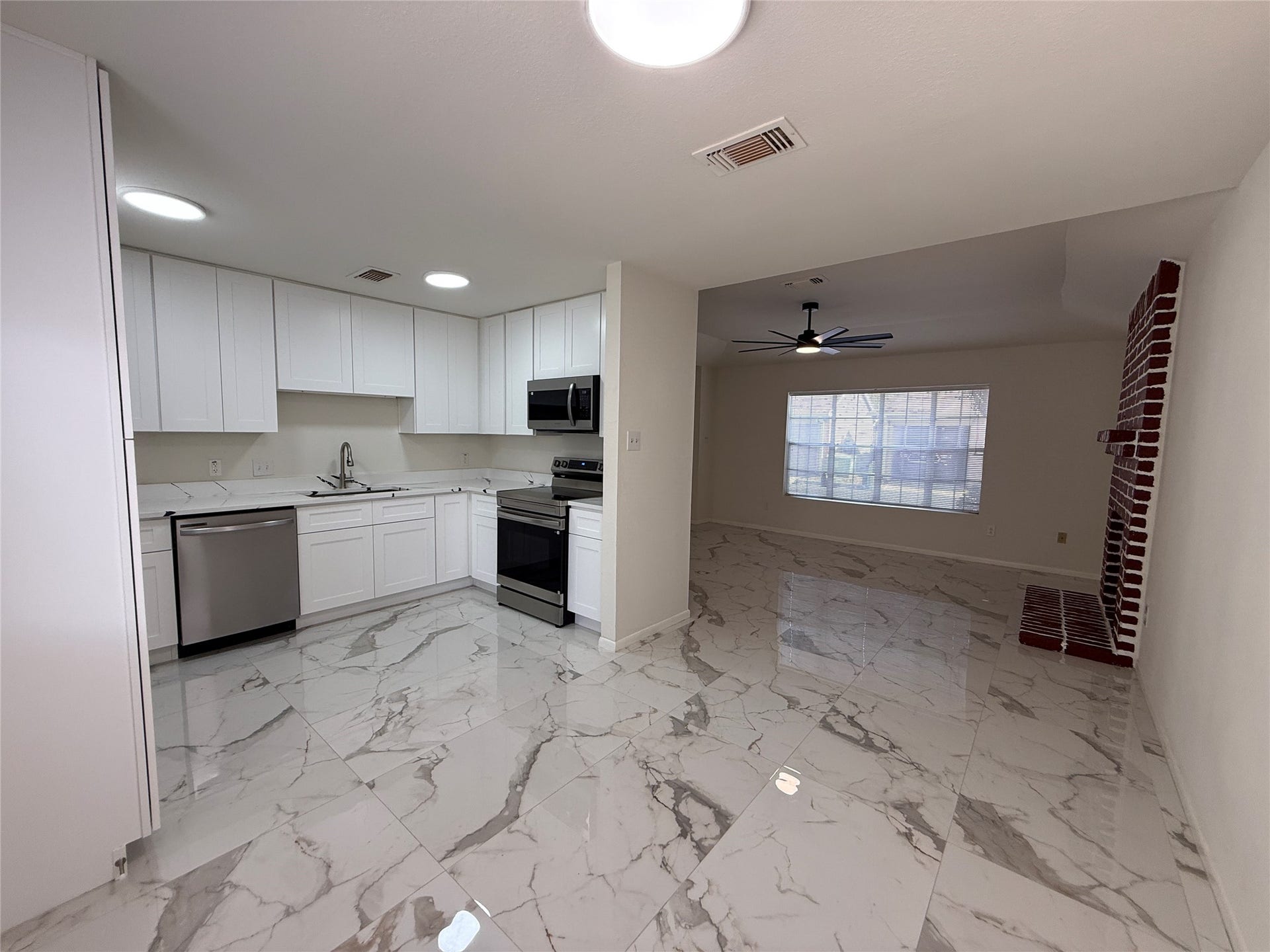 View of the open floor plan looking towards living area.