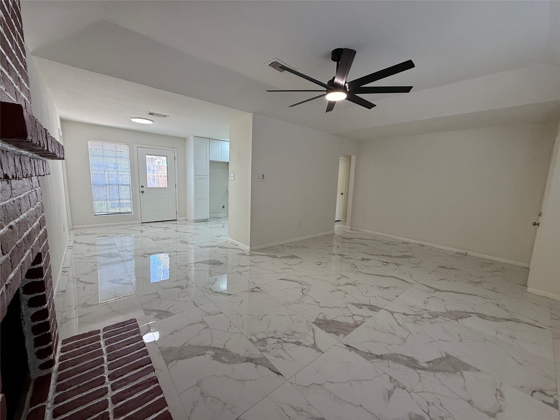 Living are looking towards kitchen and dining area.