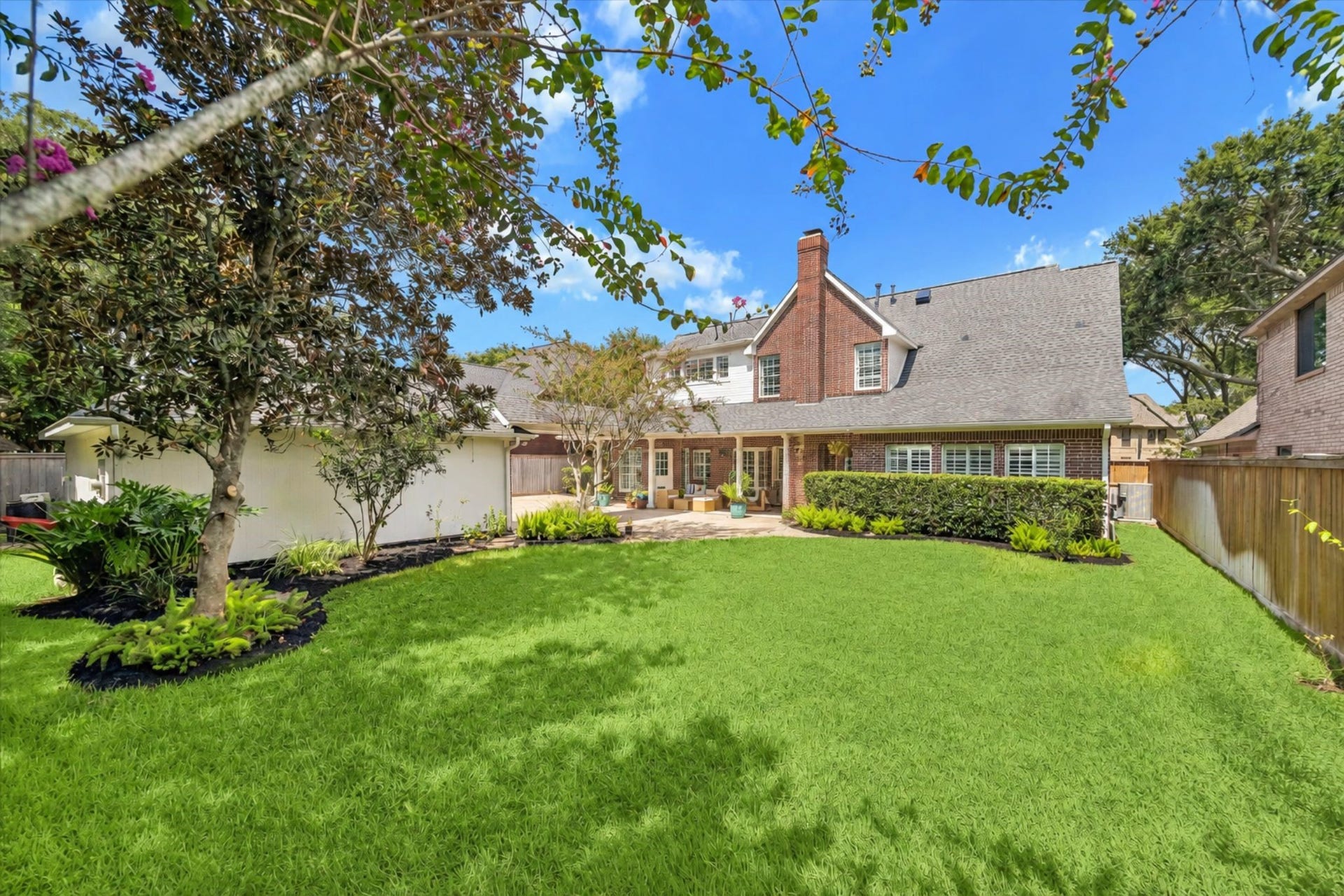 30 SAINT SIMONS COURT, Sugar Land, TX 77479 THE LARGE BACKYARD OFFERS OPEN GREEN SPACE, MATURE TREES, AND PLENTY OF ROOM FOR PLAY OR OUTDOOR ENTERTAINING.