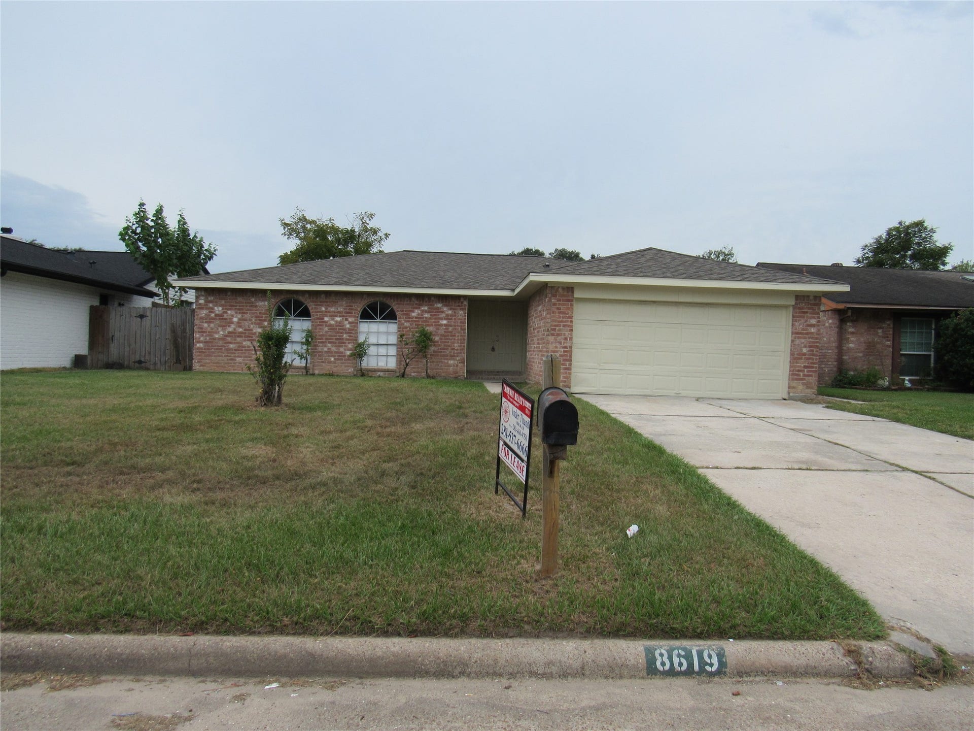 Front vie of the house with long wide driveway to park 8 cars including garage.