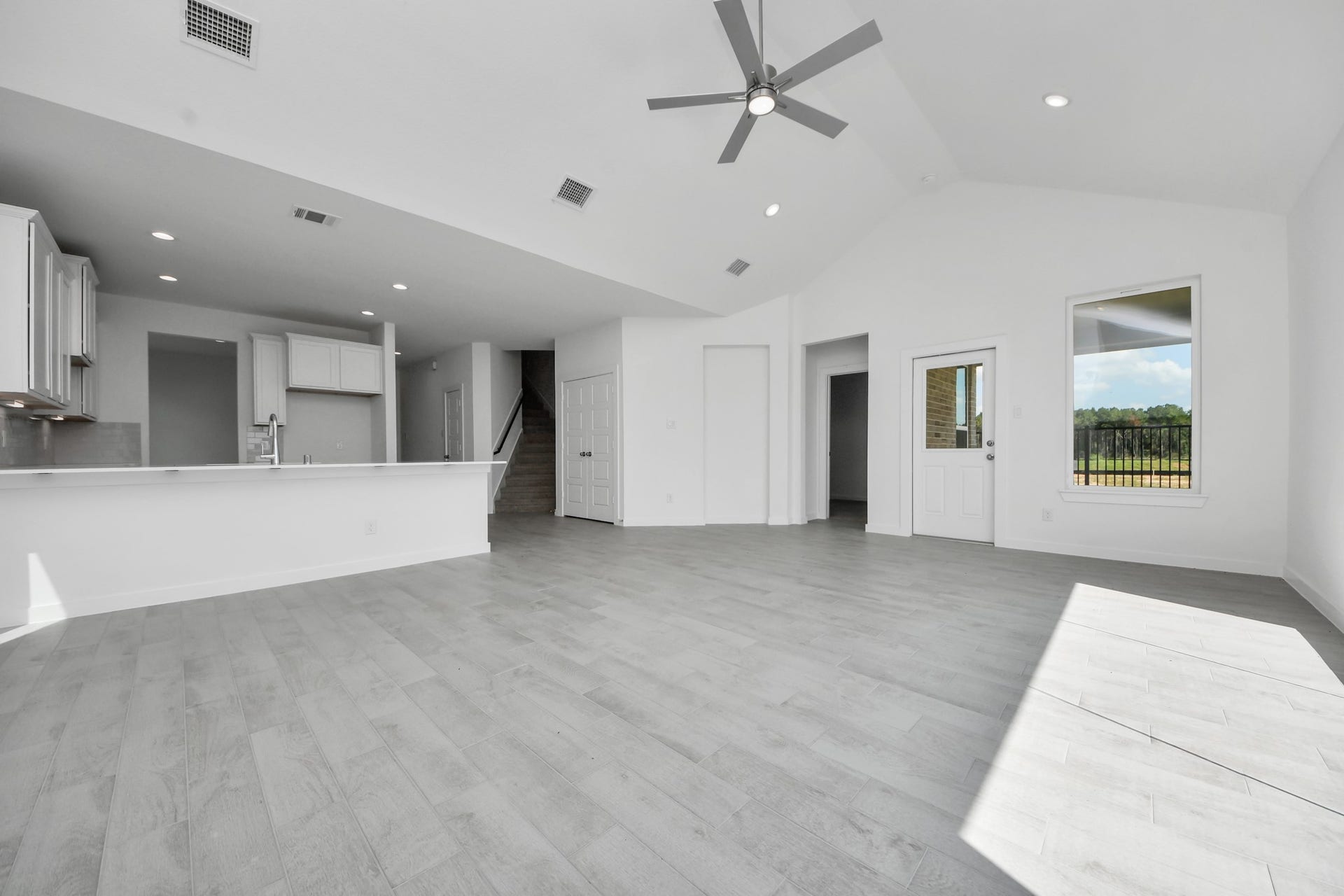 3072 Spoolwood Trail, Magnolia, TX 77355 Take another glimpse into the heart of the home with this additional view of the family rooma sprawling space ready to accommodate all your gatherings.