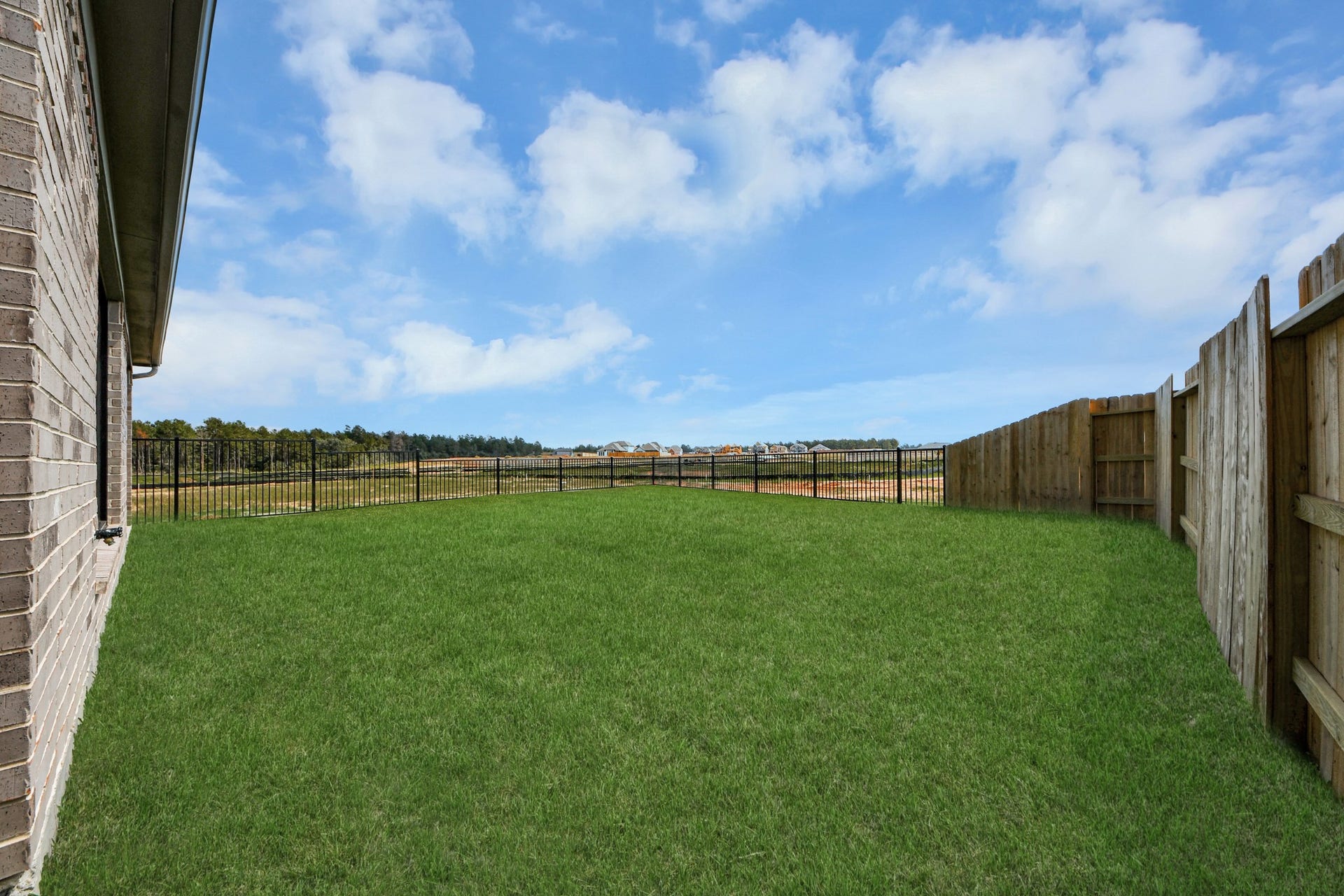3072 Spoolwood Trail, Magnolia, TX 77355 Backyard retreat, offering an abundance of space for kids to play and explore. The possibilities are endless in this outdoor haven, where the joy of open-air activities and family gatherings awaits.
