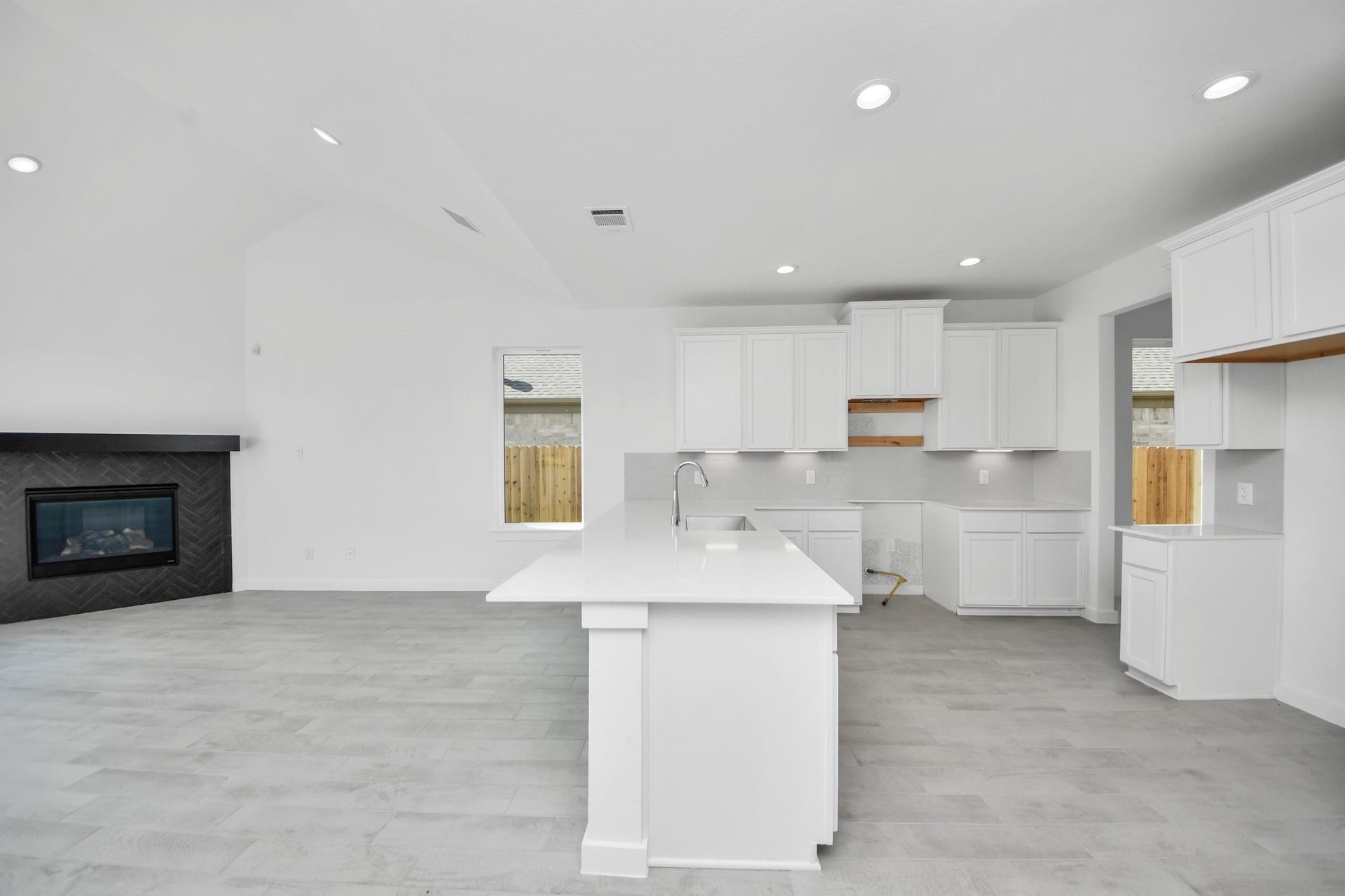 3072 Spoolwood Trail, Magnolia, TX 77355 The open concept effortlessly connects the kitchen to the expansive family room, forming a perfect hub for gatherings. This seamless flow creates an inviting space where cooking and socializing come together harmoniously.