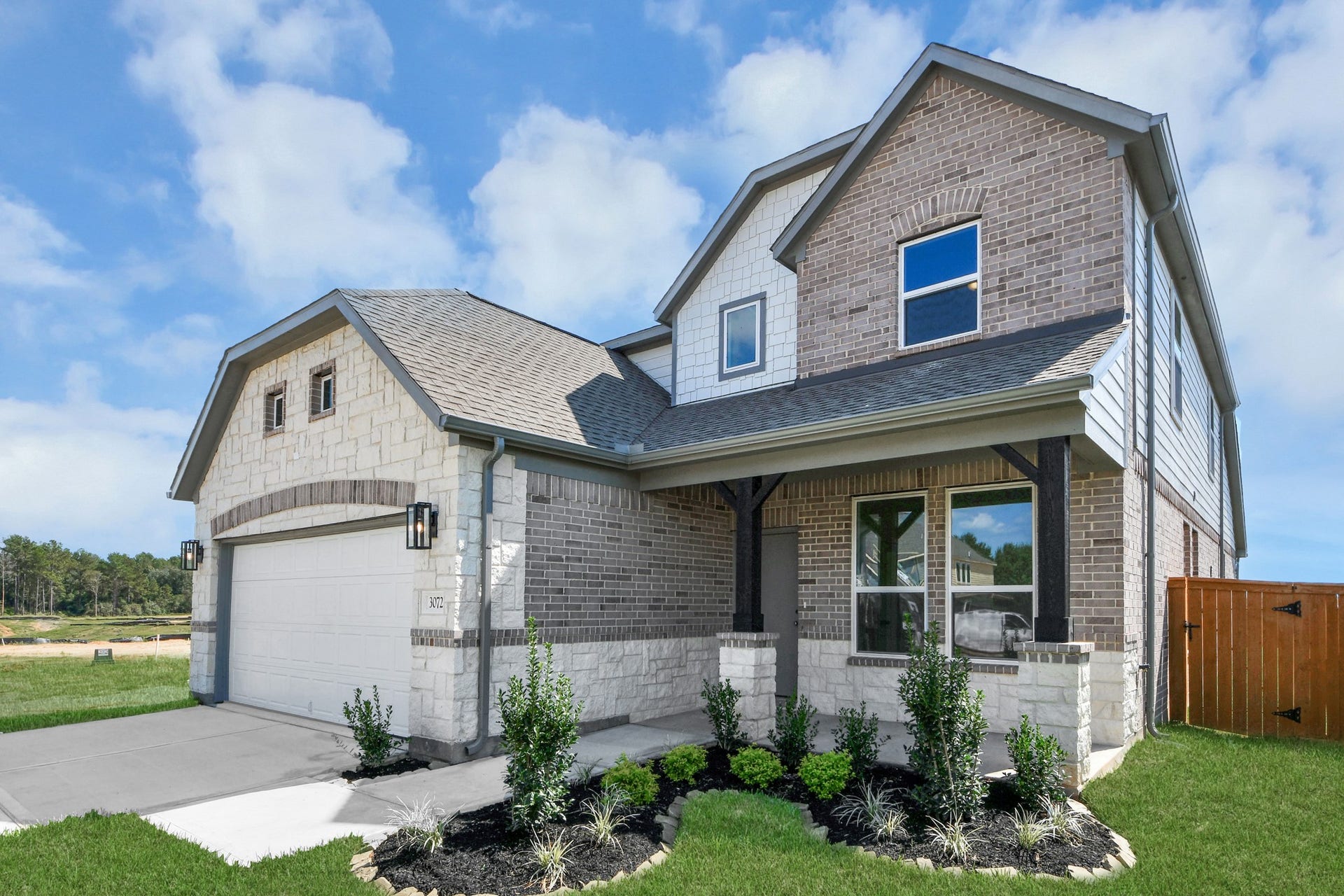 3072 Spoolwood Trail, Magnolia, TX 77355 Home features a convenient 2-car garage complemented by a spacious driveway, offering ample parking for you and your guests.