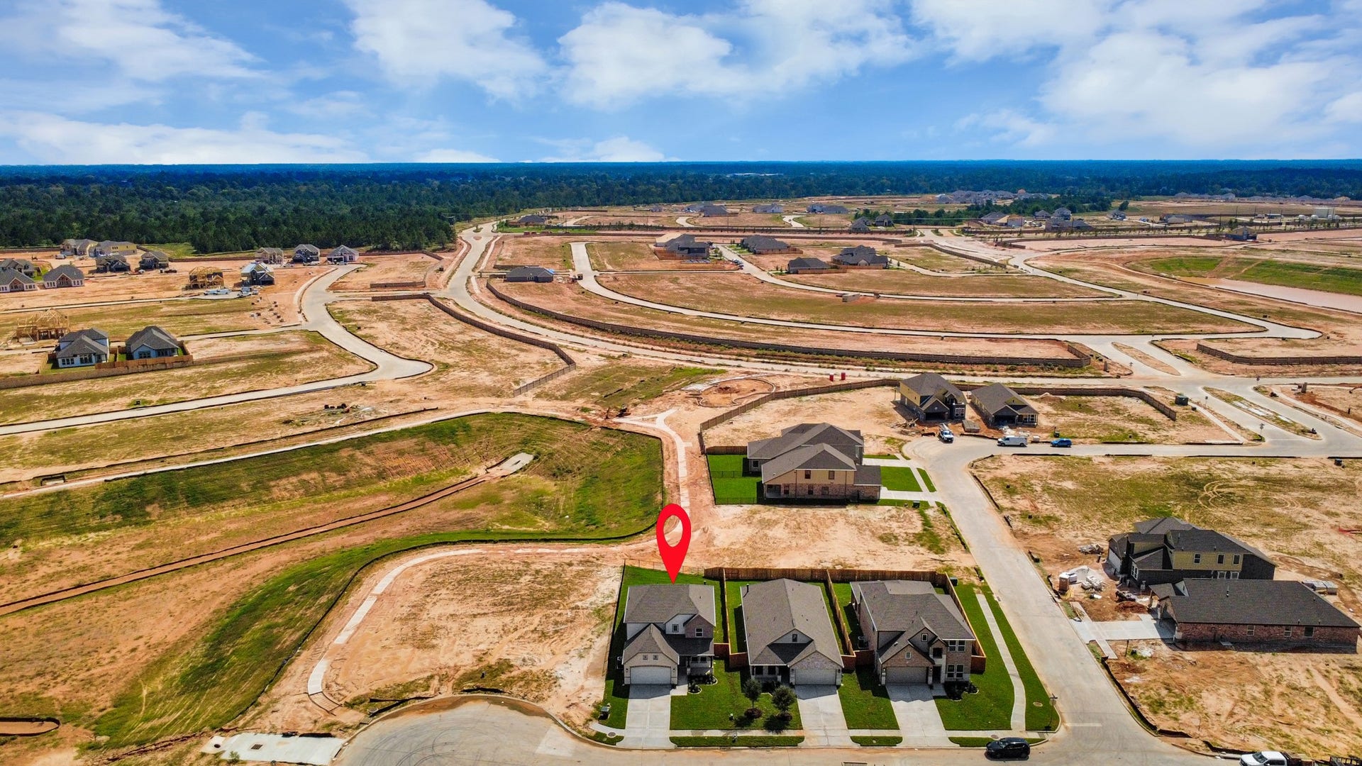 3072 Spoolwood Trail, Magnolia, TX 77355 An aerial view of a spacious subdivision lot, highlighting a well-maintained yard and a fully fenced perimeter, offering both privacy and expansive outdoor space.
