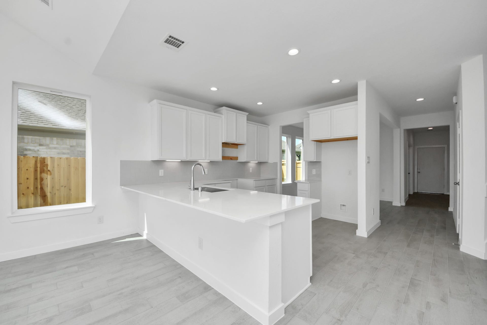 3072 Spoolwood Trail, Magnolia, TX 77355 The extended counter area adds both practicality and style, making meal preparation a breeze. Every detail is thoughtfully designed to enhance the kitchen's functionality and aesthetic appeal.