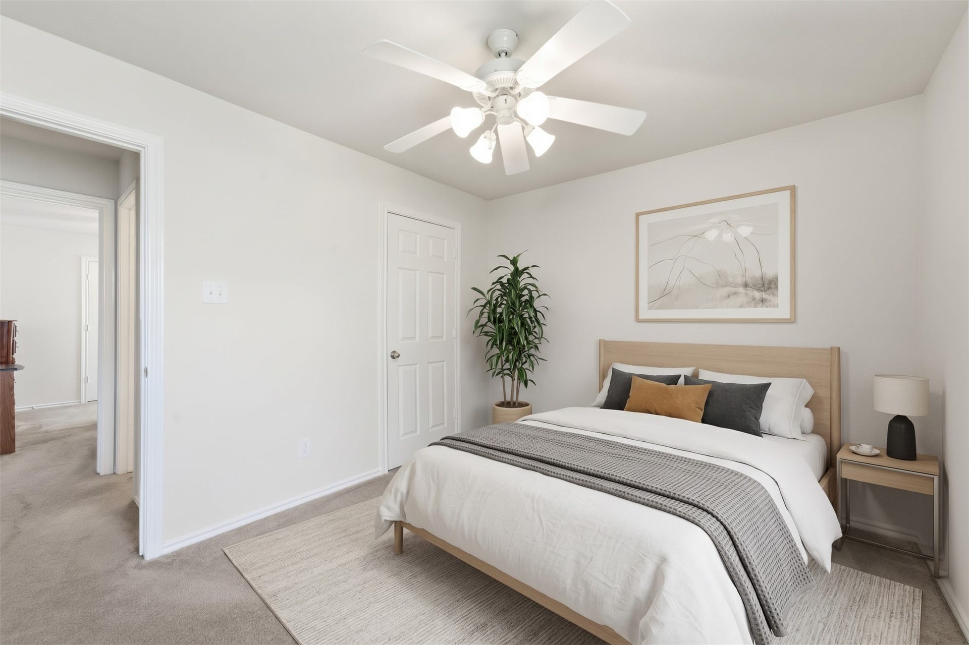 2426 Floral Ridge Drive, Spring, TX 77388 The third additional bedroom offers a versatile space perfect for a guest suite or home office, highlighted by neutral tones and a bright overhead ceiling fan.