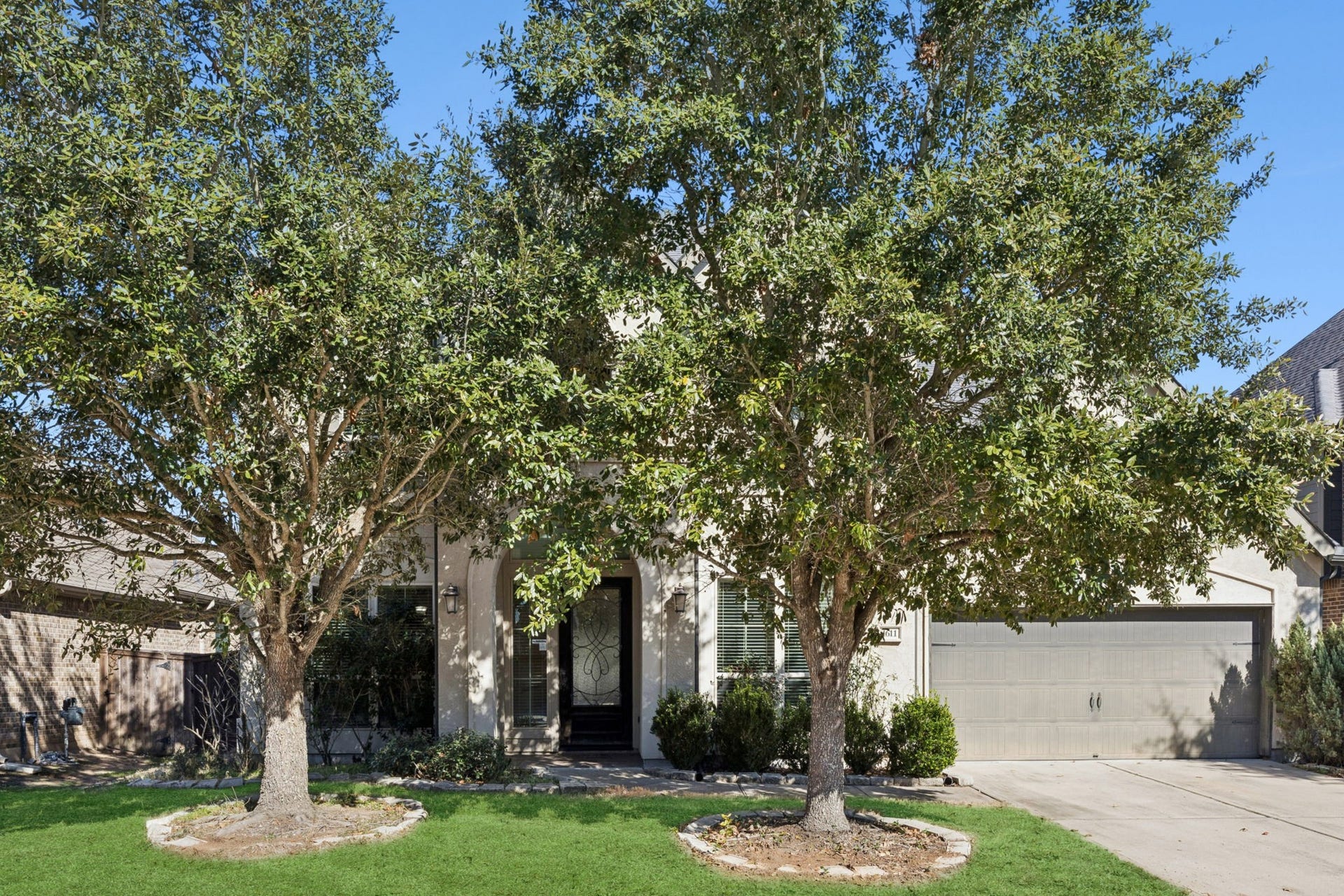 Welcome to 1611 Tonkawa Trail! This stunning Perry Home in Cane Island offers the perfect blend of traditional elegance and modern luxury in Katy, TX.
