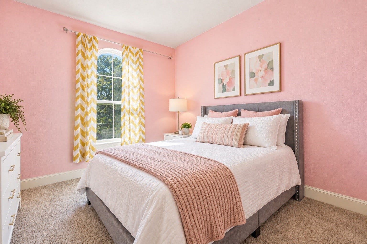 This bright bedroom features a spacious layout with a beautiful arched window that invites ample light. Virtually staged so you can imagine the possibilities.