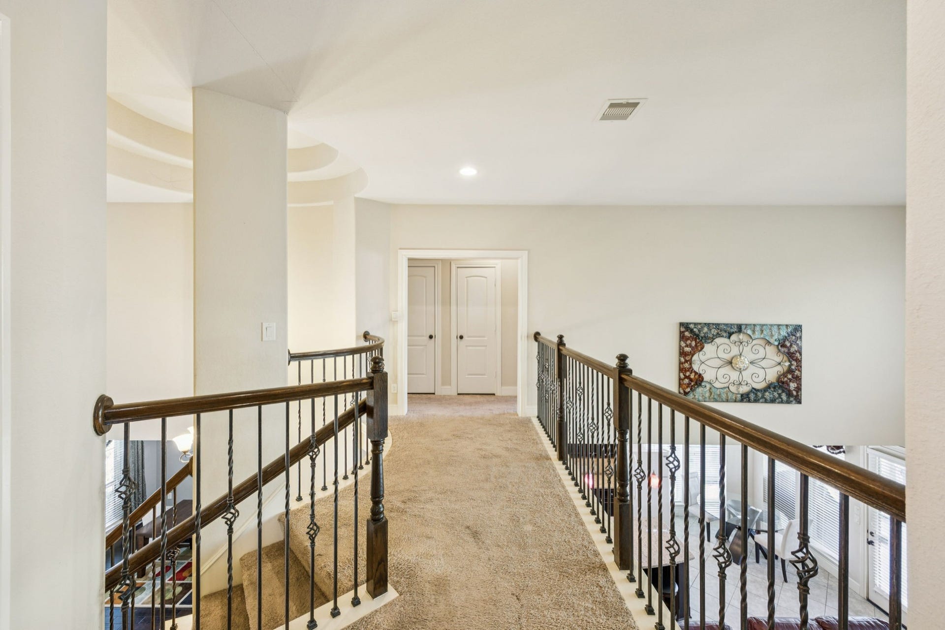 This upstairs layout offers ideal separation and flexibility, with one wing featuring a private bedroom, full bath, game room, and media room, while the opposite wing includes two bedrooms connected by a full bathroomperfect for guests or family living.