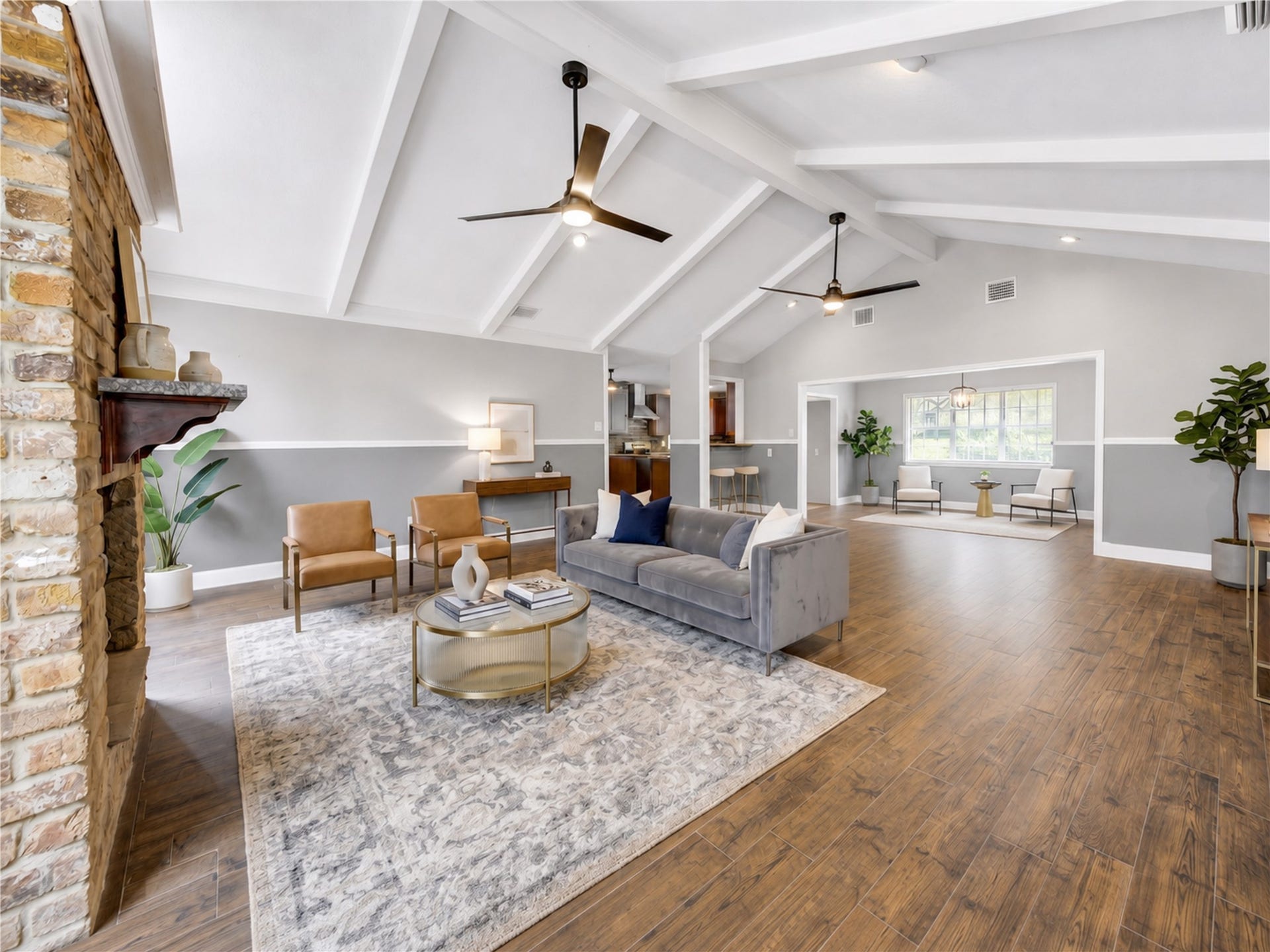 814 Stone Mountain Drive, Conroe, TX 77302 Spacious Living Room with Vaulted Beamed Ceiling - AI staging
