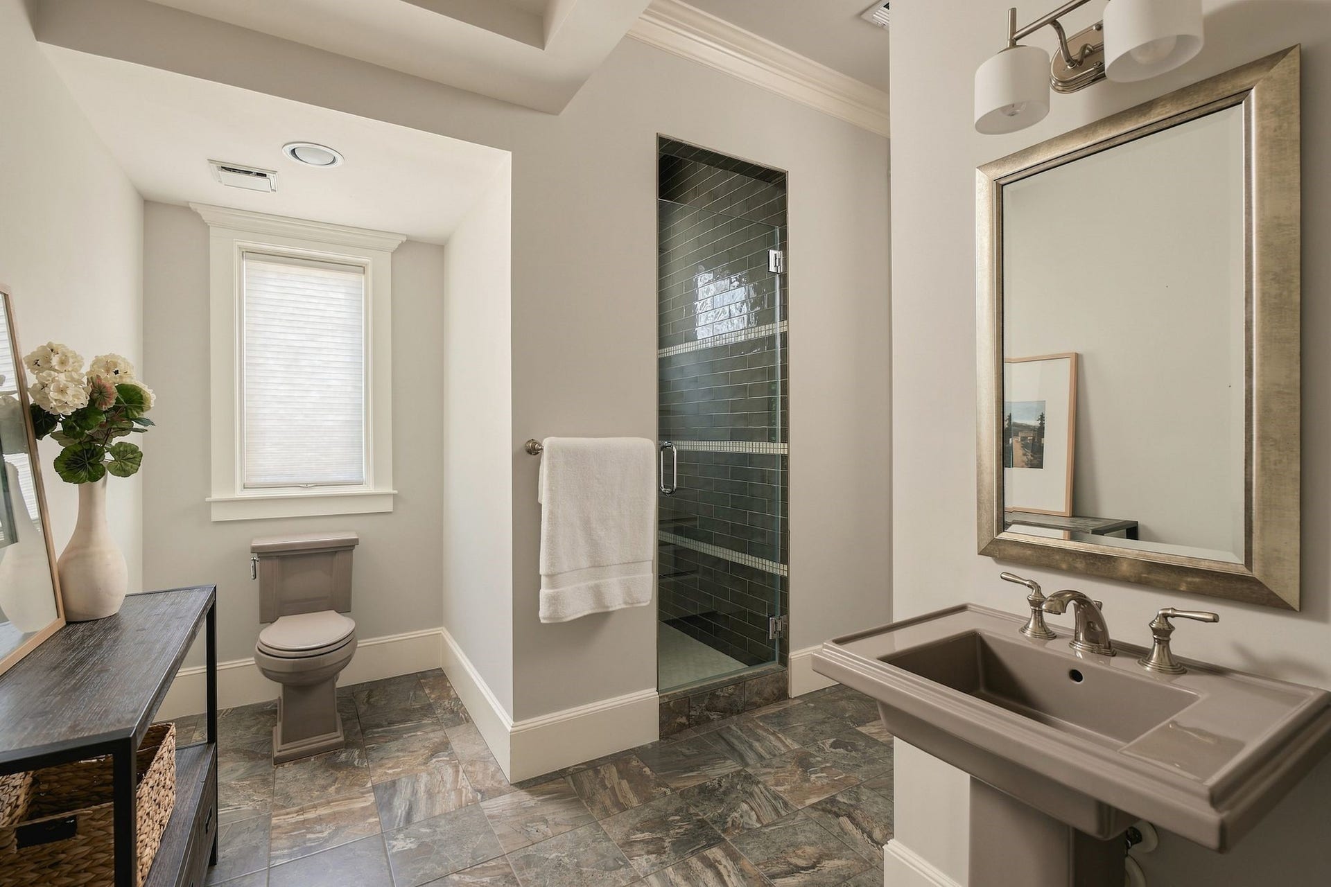 2012 Harvard Street, Houston, TX 77008 The full bathroom downstairs has a walk in shower with stylish tile work.