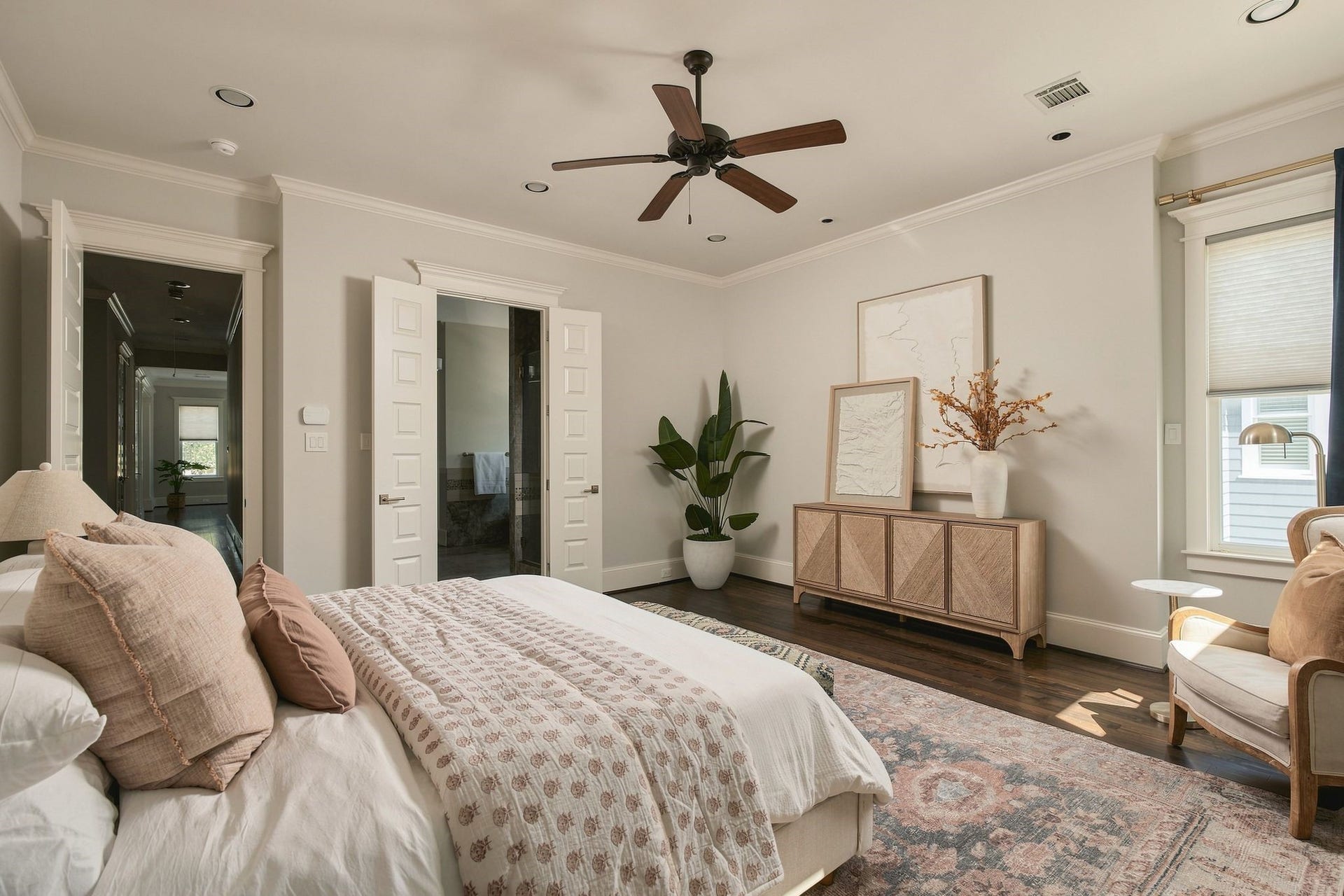 2012 Harvard Street, Houston, TX 77008 Double doors open to reveal a spacious retreat, complete with soaring ceilings, abundant natural light, and room for both a king-sized bed and a sitting area.