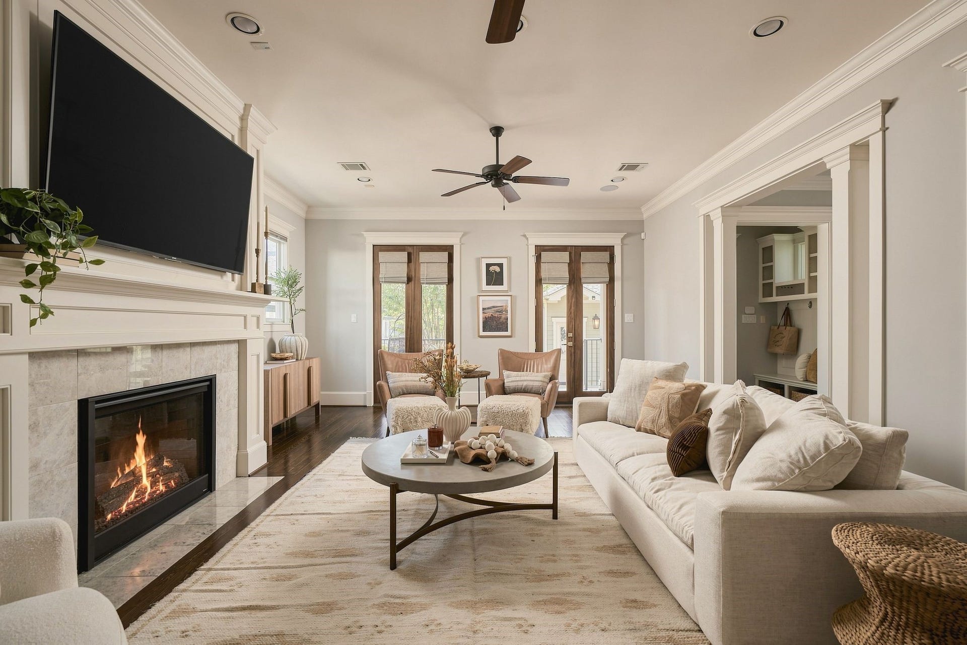 2012 Harvard Street, Houston, TX 77008 The sun-drenched living room is centered by a fireplace and framed by large windows that invite in an abundance of natural light.
