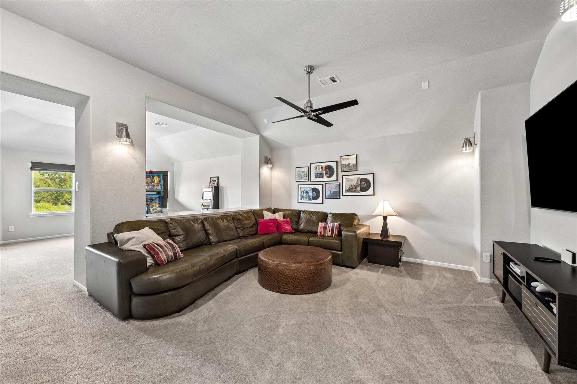 21322 Prairie Plains Lane, Richmond, TX 77406 Oversized media room features room for movie nights while behind is a counter for serving and another game room space for overflow!