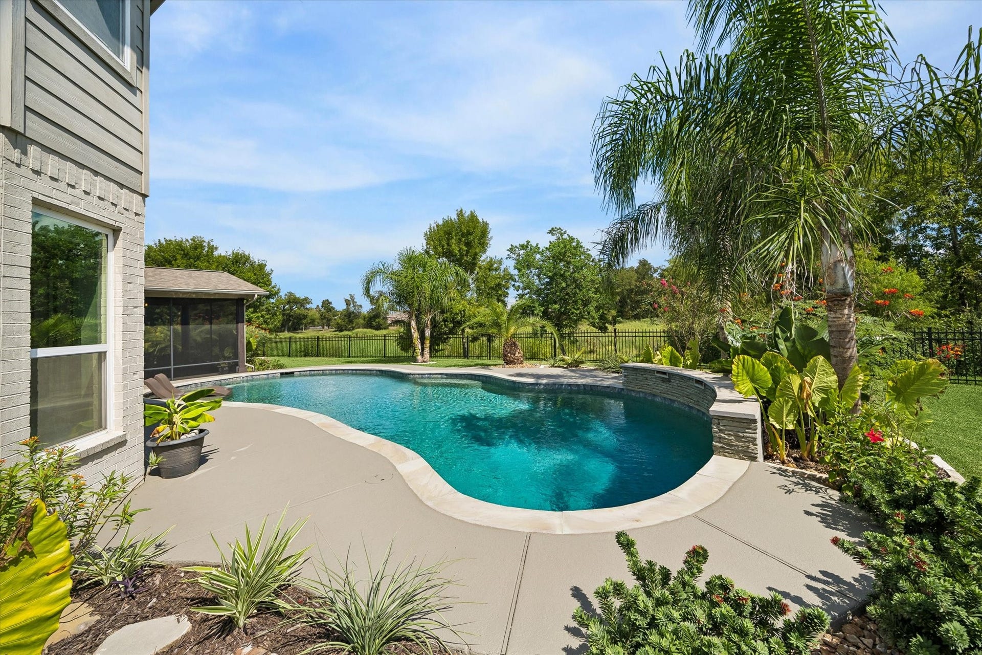 21322 Prairie Plains Lane, Richmond, TX 77406 View of stunning pool with wetland preserve just behind! Total privacy and watch stunning birds fly by! There is a pool heater and room for a hot tub if needed.
