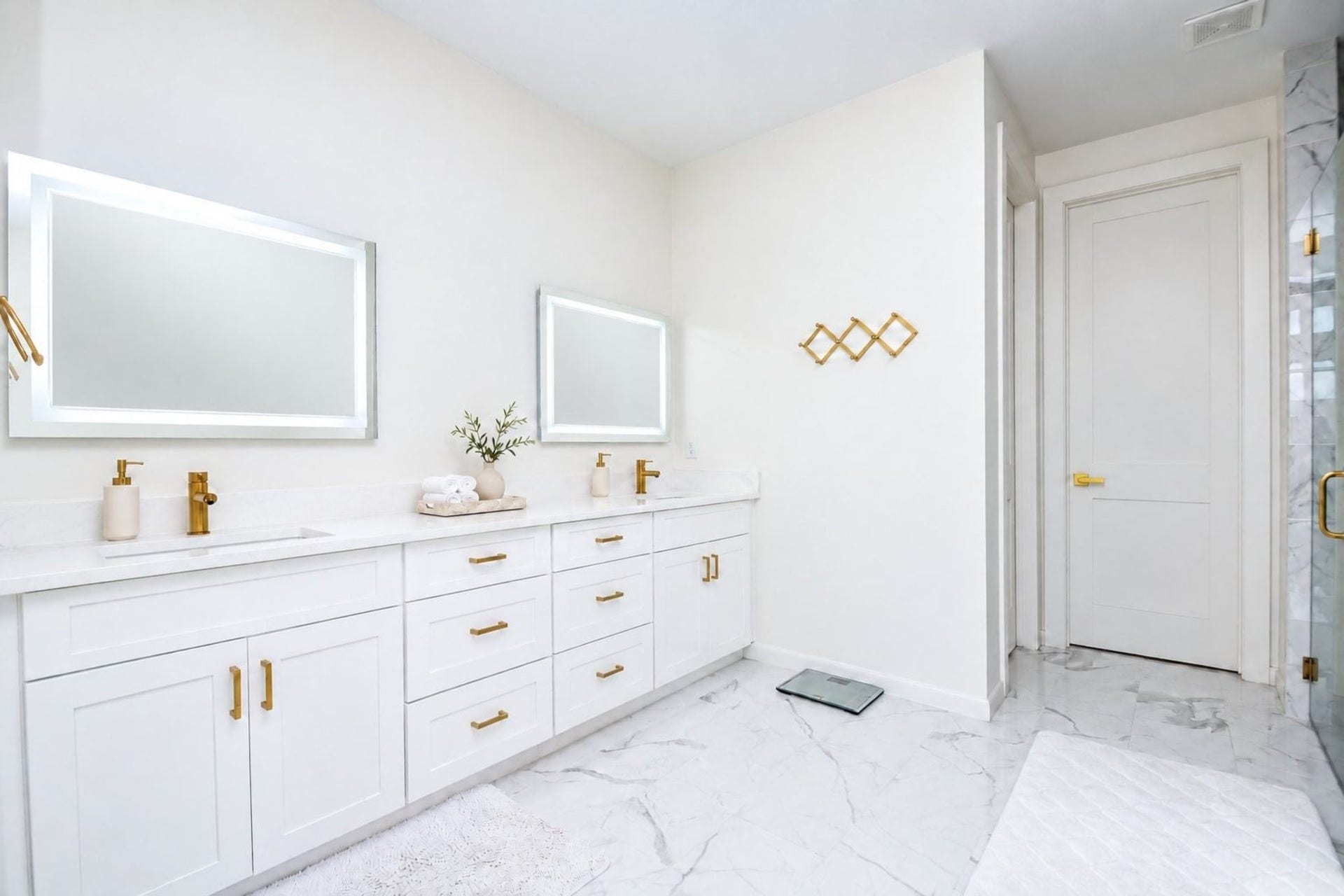 4031 Lanark Lane, #B, Houston, TX 77025 Your primary ensuite bathroom is a magical, tranquil study in pure white --- which somehow imparts a secure, cozy feeling. Sometimes, basics are best. The long counter features dual sinks/great storage below and two striking framed wall mirrors, above.