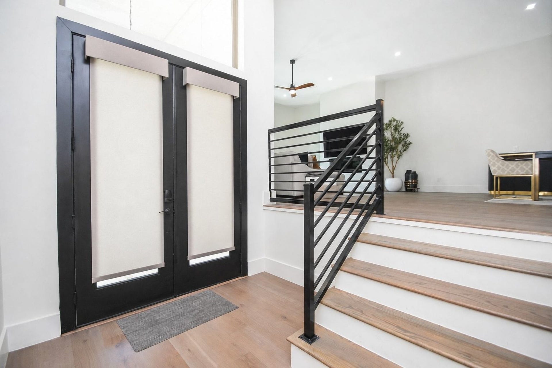 4031 Lanark Lane, #B, Houston, TX 77025 Modern structural simplicity invites us in while displaying easy elegance in this inside view of the front entry.