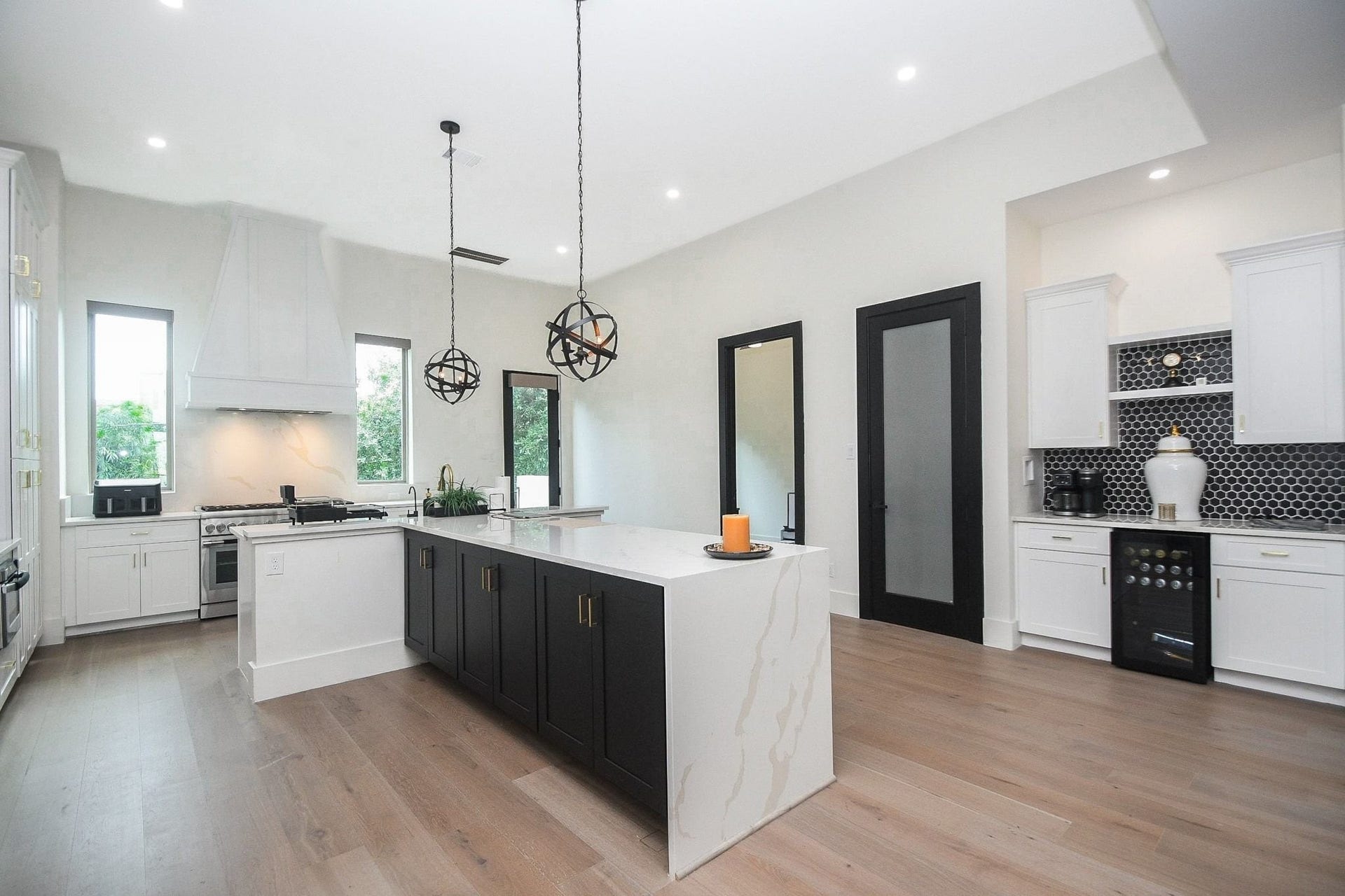 4031 Lanark Lane, #B, Houston, TX 77025 Here's another wide open view of the kitchen --- a striking study in practical black and white.