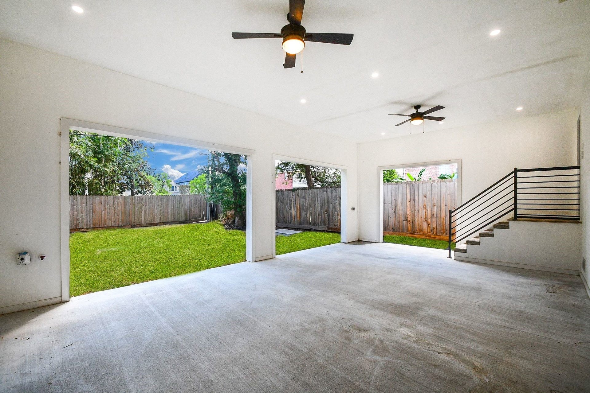 4031 Lanark Lane, #B, Houston, TX 77025 Your huge backyard patio will provide shelter rain or shine! Spacious covered patio features gas hookups built into the far left wall for convenient outdoor grilling, with ceiling fans, recessed lighting and views of the fenced backyard. Durable epoxy fills the floor.
