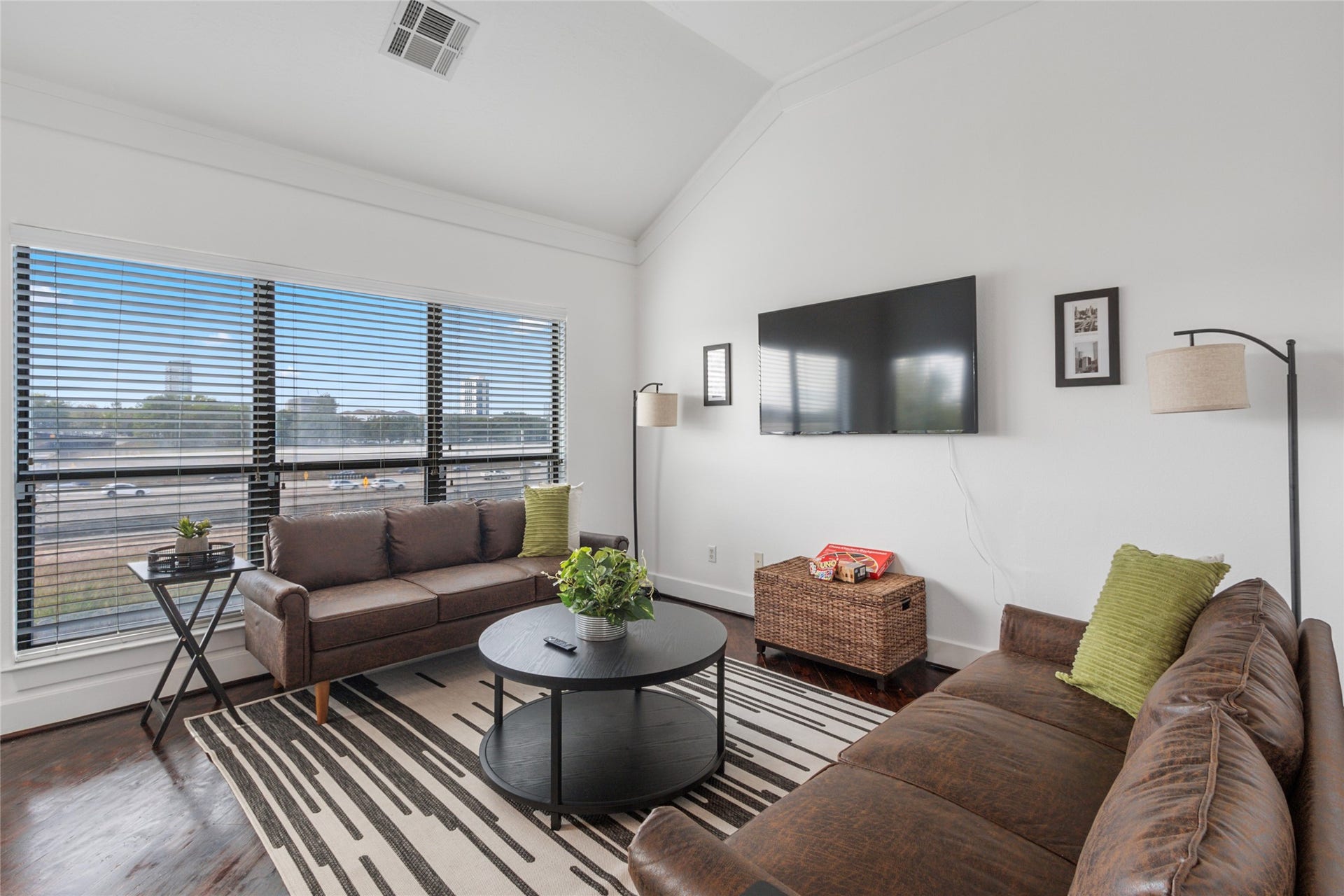 Living room with large windows and downtown views.