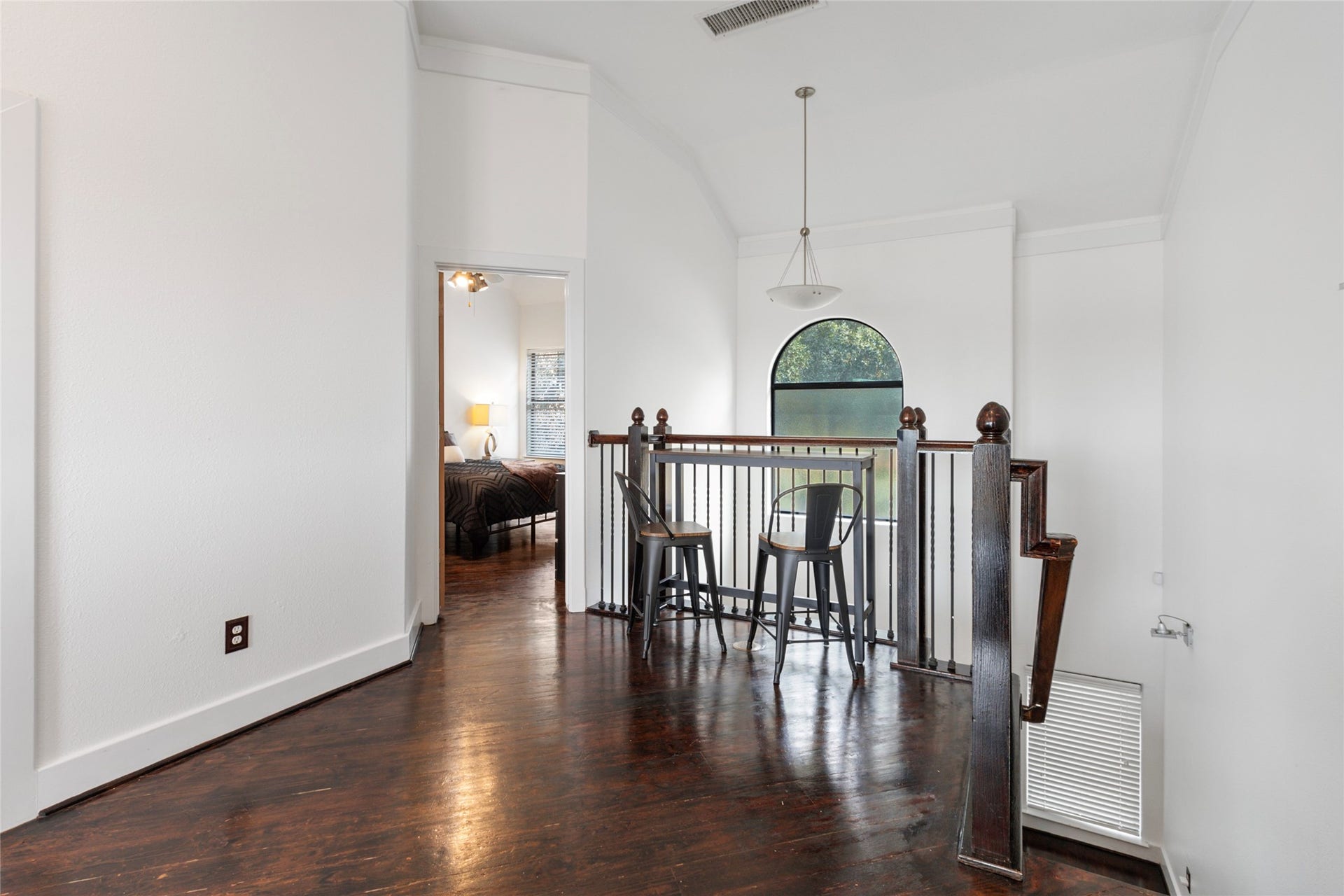 Dining area with wood flooring and an open layout.