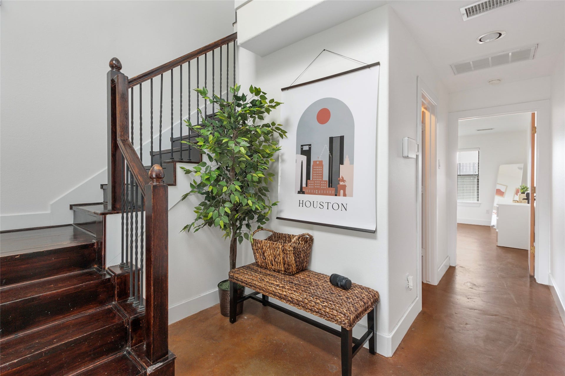 Welcoming entry with hardwood floors and staircase