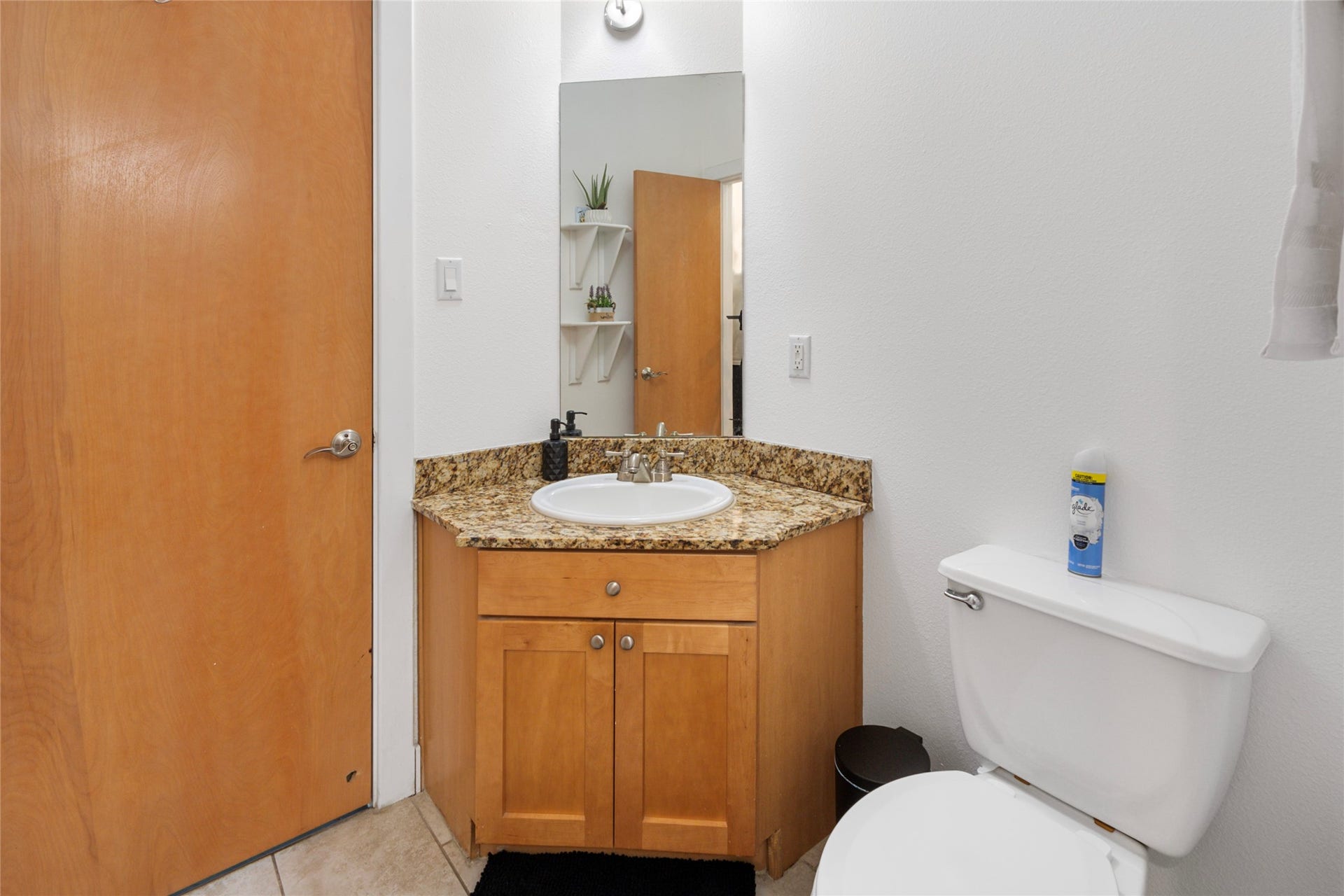 Convenient half bath with corner vanity
